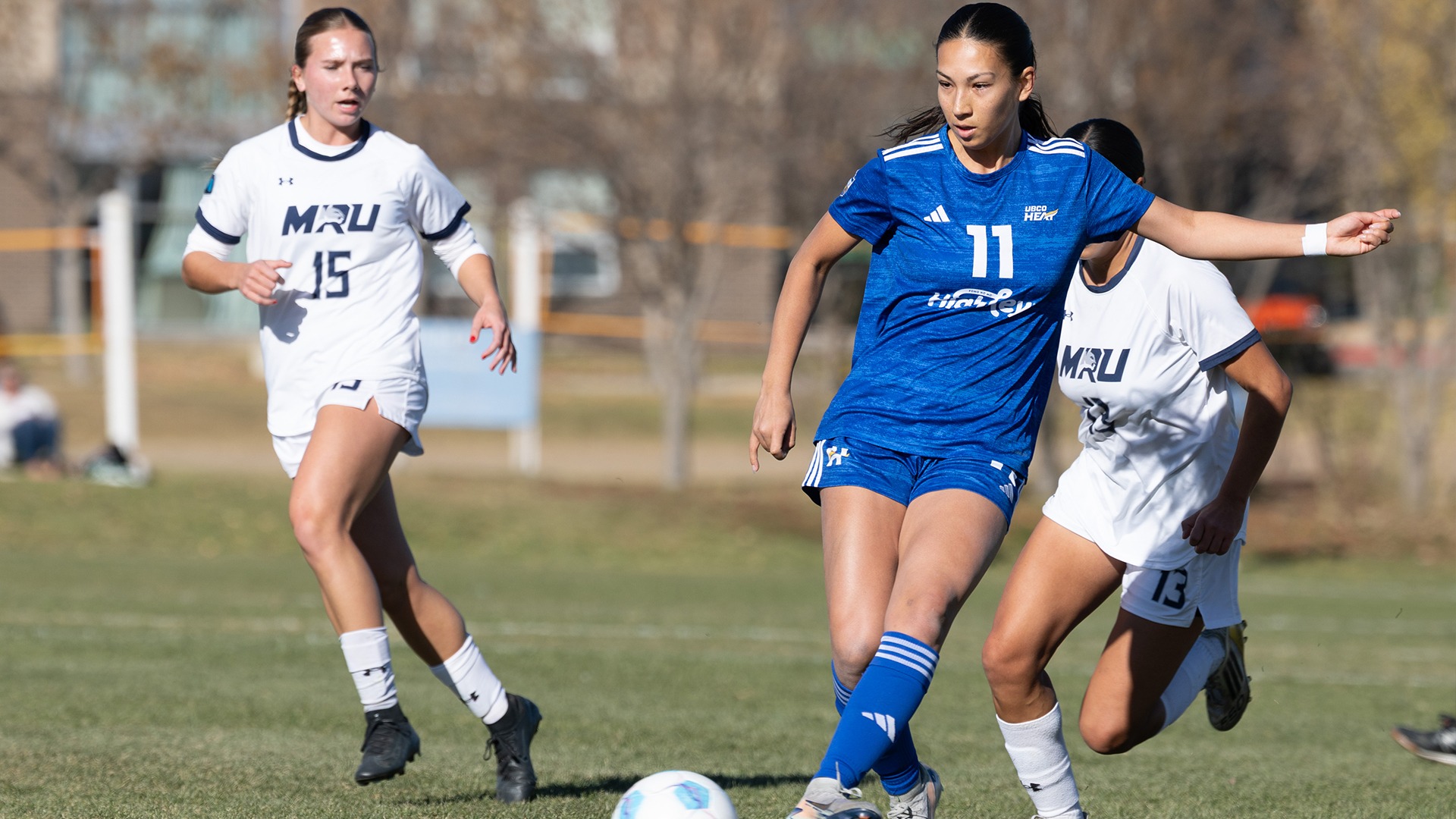 UBCO forward Abigail Taneda makes a pass during action against the Mount Royal Cougars in the Canada West Quarter-finals in Calgary.