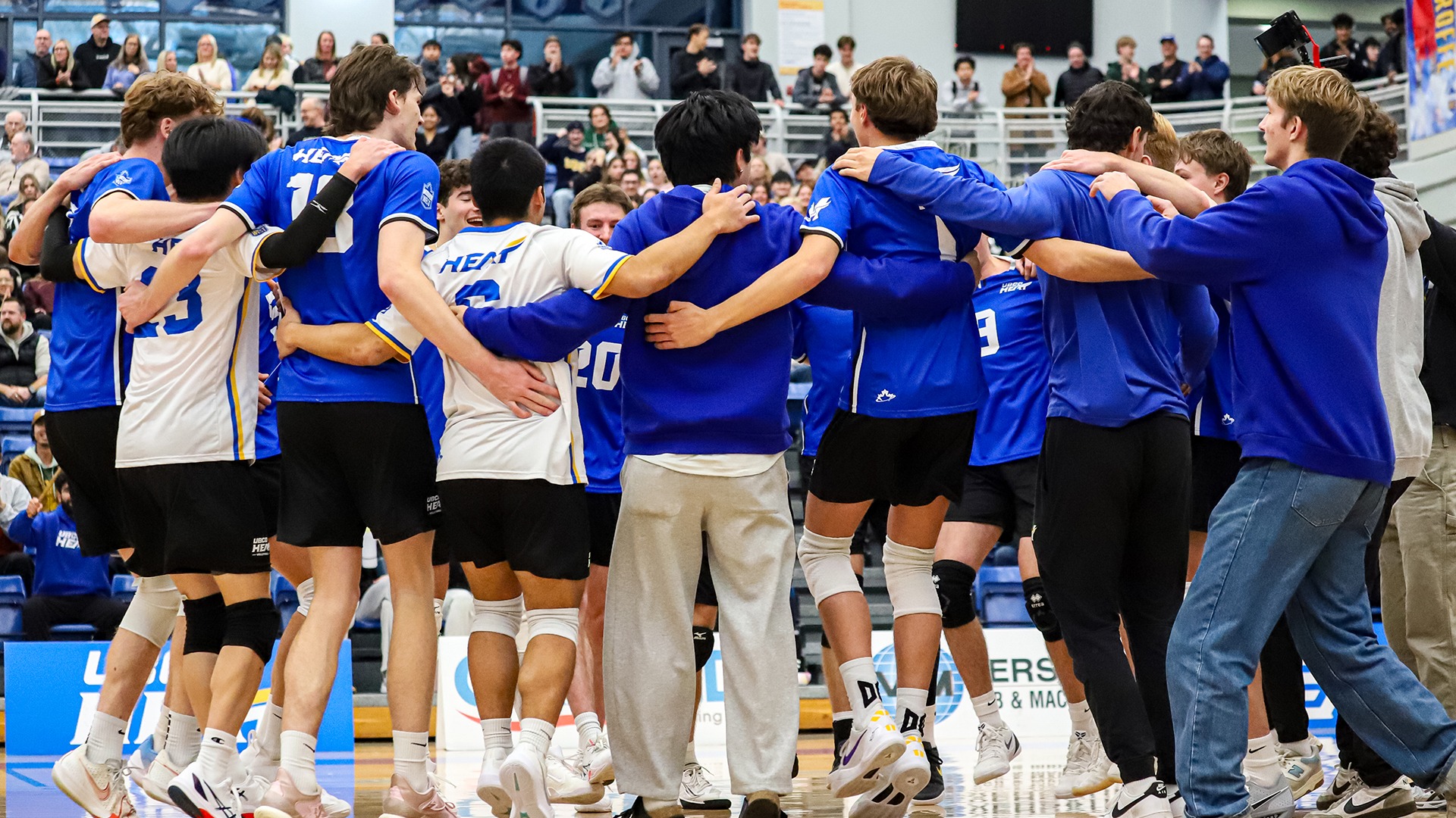 The UBCO Heat men's volleyball team celebrates a victory over the Thompson Rivers WolfPack at the UBCO Gymnasium.