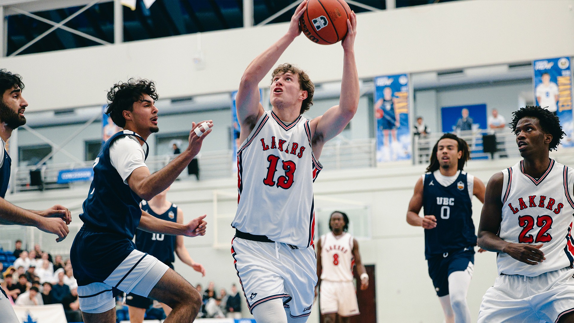 UBCO guard Anthony Brady, sporting the team's throwback Lakers uniform, drives to the basket during action against the UBC Thunderbirds at the UBCO Gymnasium.