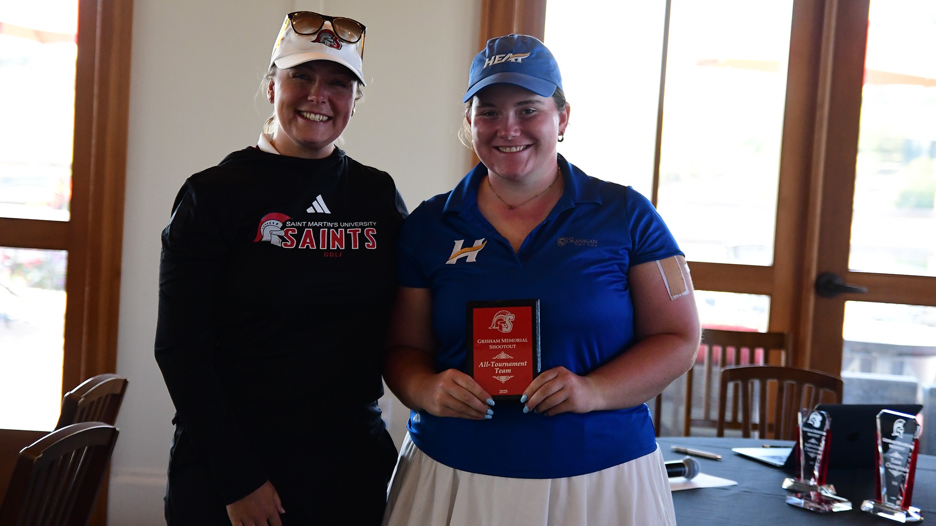 UBCO women's golfer Julia Alexander-Carew (right) poses with her All-Tournament Team plaque after finishing second at the Grisham Memorial Shootout in DuPont, Washington.