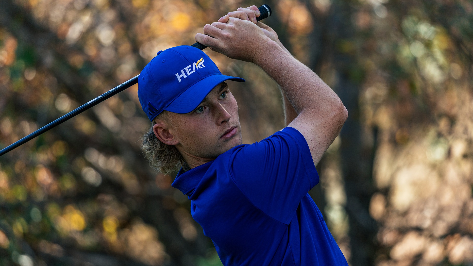 UBCO golfer Ryan Vest watches his shot during qualifying round action at the Okanagan Golf Club.