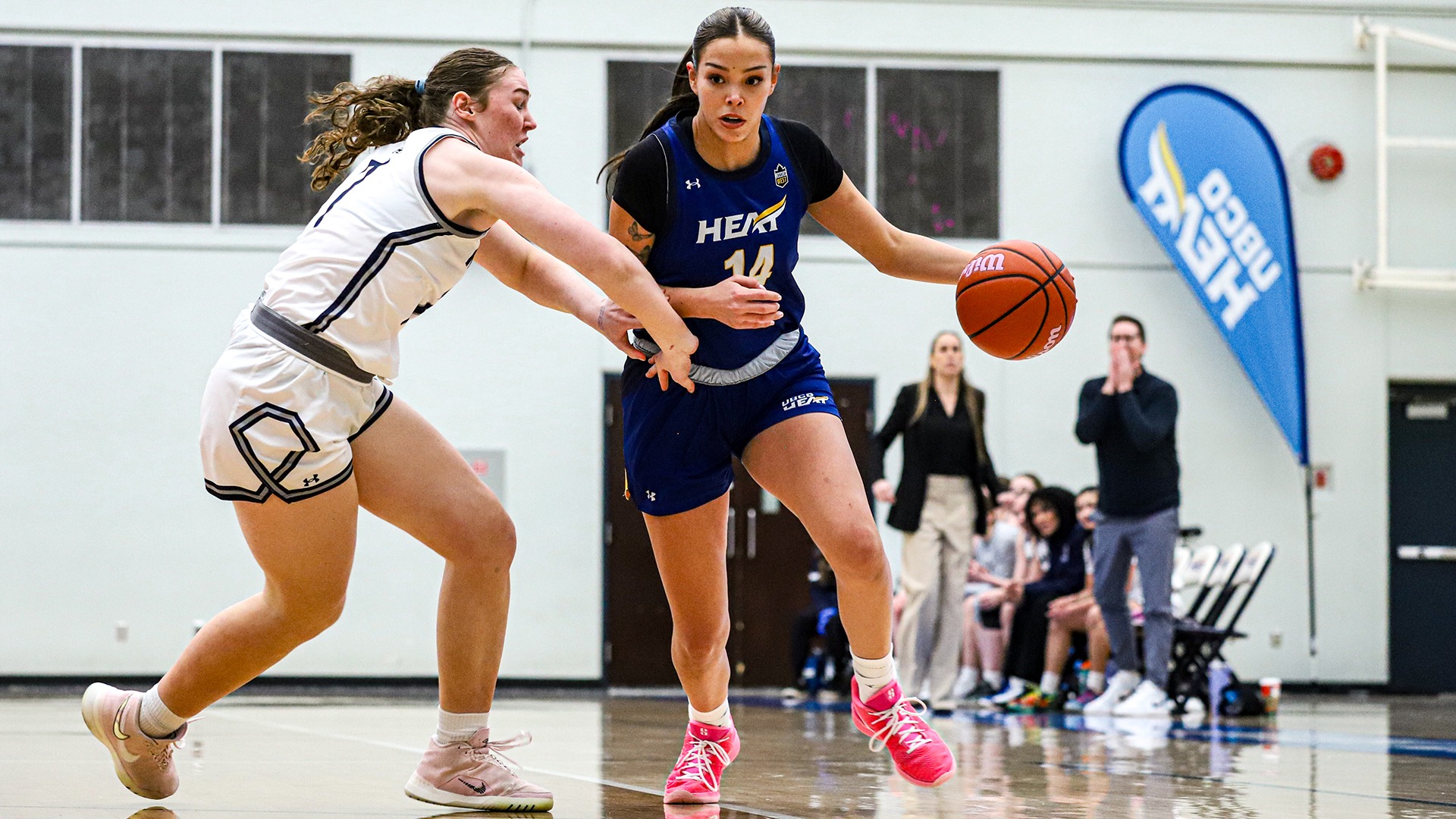 UBCO guard Kanani Coon drives past her defender during action against the Mount Royal Cougars at the UBCO Gymnasium.