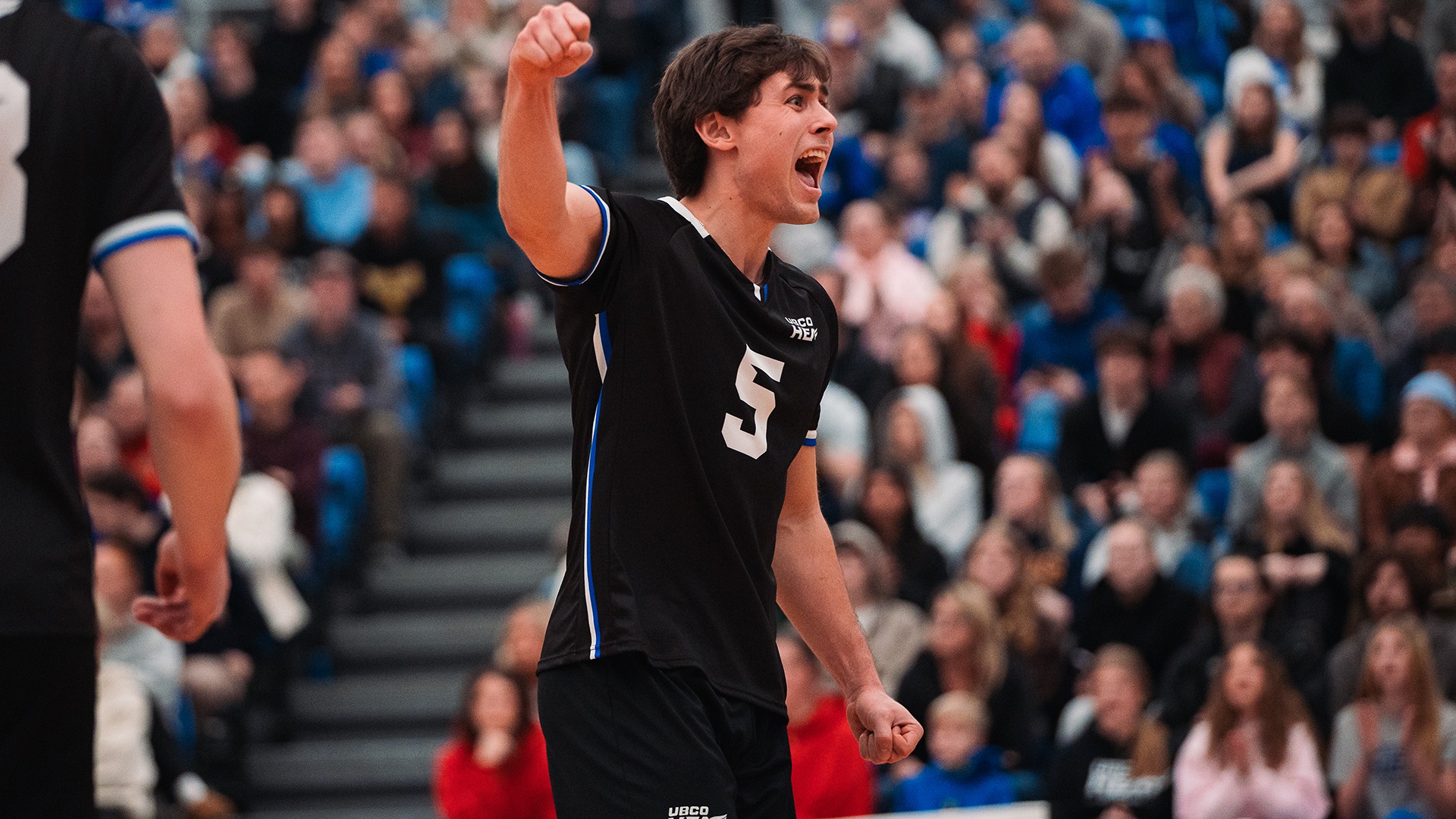 UBCO setter Zach van Geel pumps his fist following a point during action against the Trinity Western Spartans at the UBCO Gymnasium.