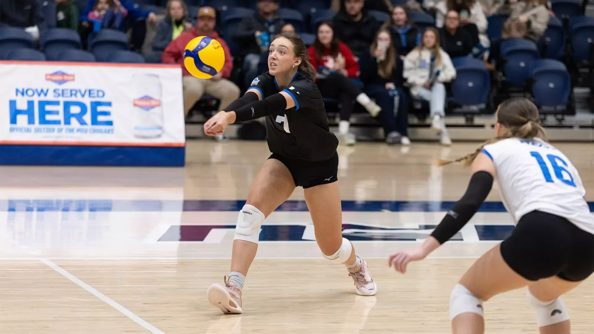 UBCO setter Kylan Finseth digs a ball during action against the Mount Royal Cougars in Calgary.