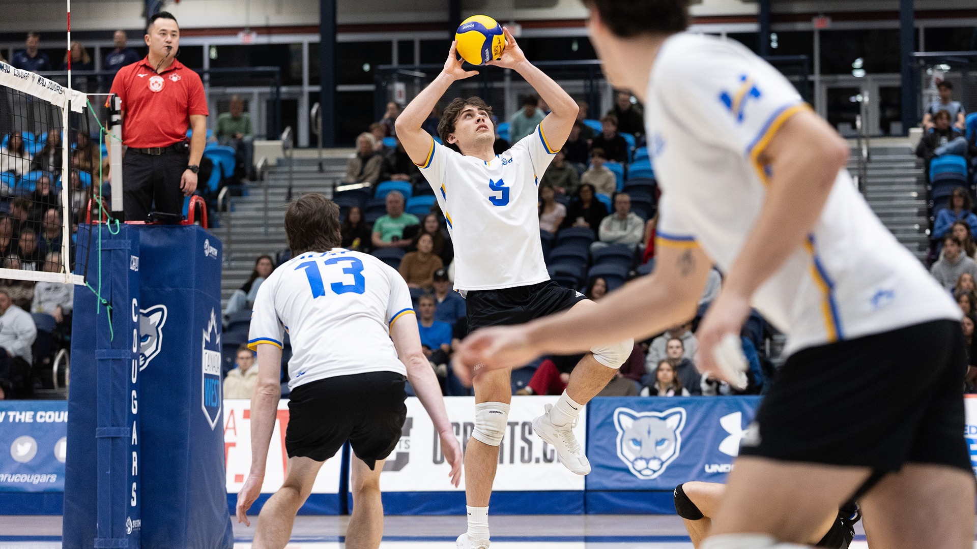UBCO setter Zach van Geel rises to set a ball during action against the Mount Royal Cougars in Calgary.