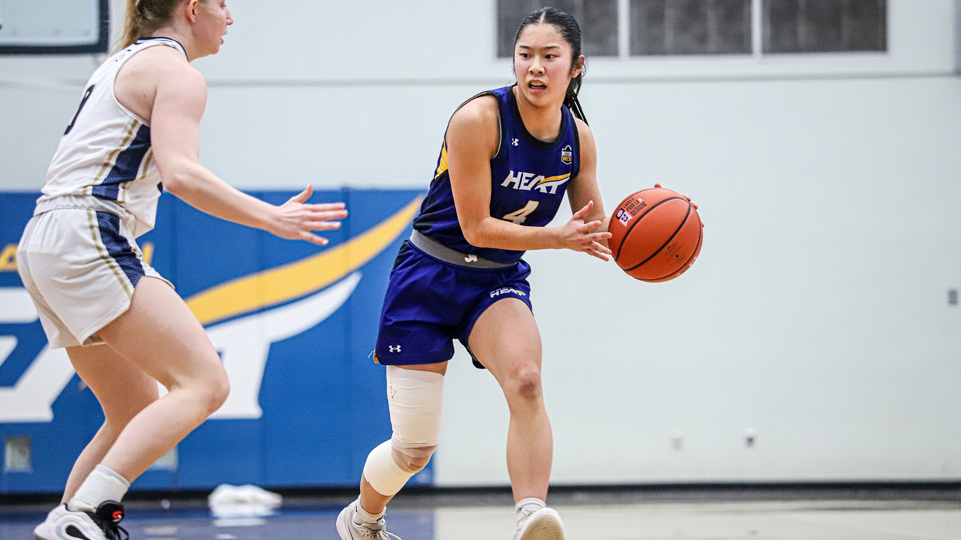 UBCO guard Tsuki Tsuzuki looks for a pass during action against the Trinity Western Spartans at the UBCO Gymnasium.