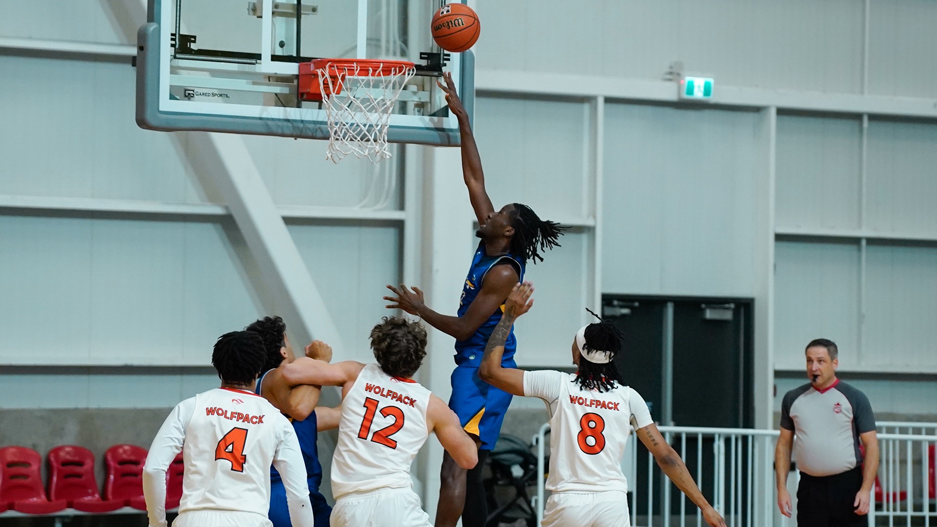 UBCO forward Lamine Conde rises for a layup against the Thompson Rivers WolfPack in Kamloops.