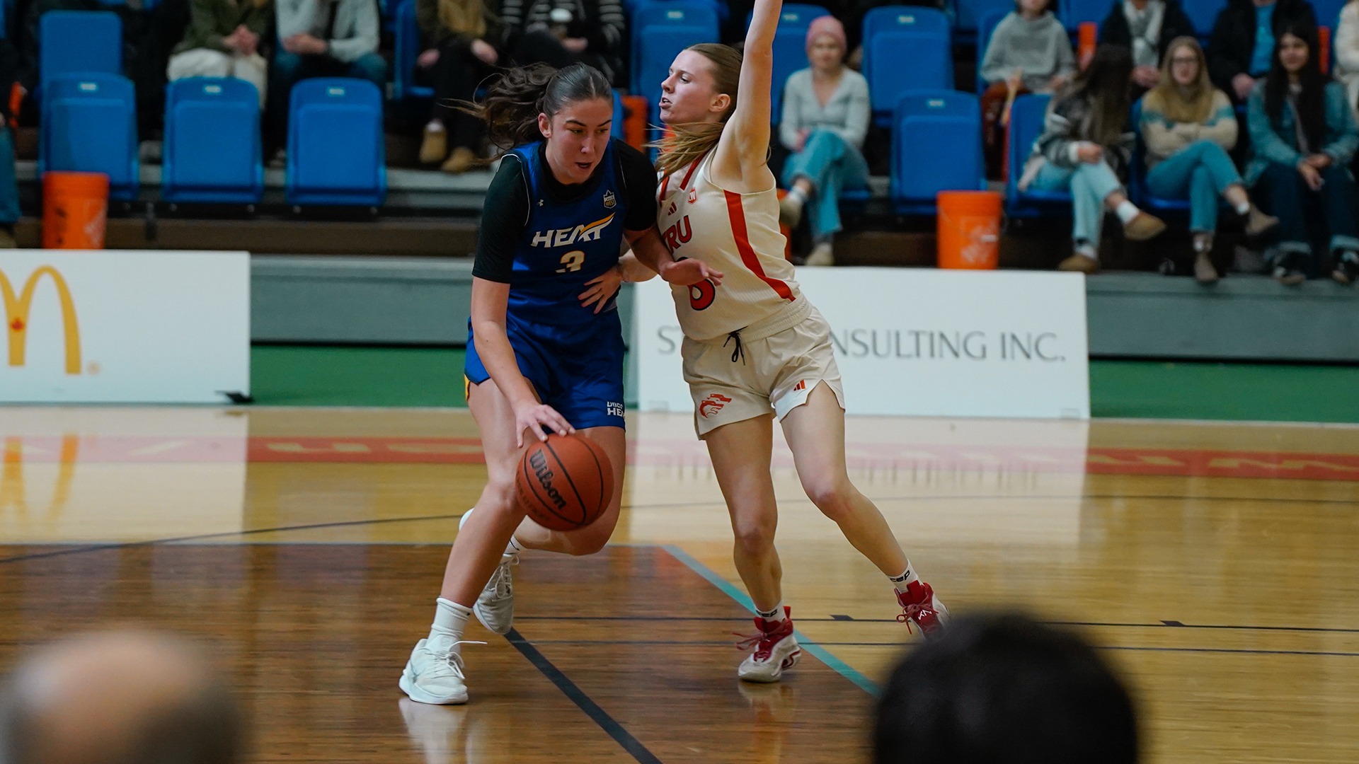 UBCO forward Tennyson McCarthy looks to get past her defender during action against the Thompson Rivers WolfPack in Kamloops.