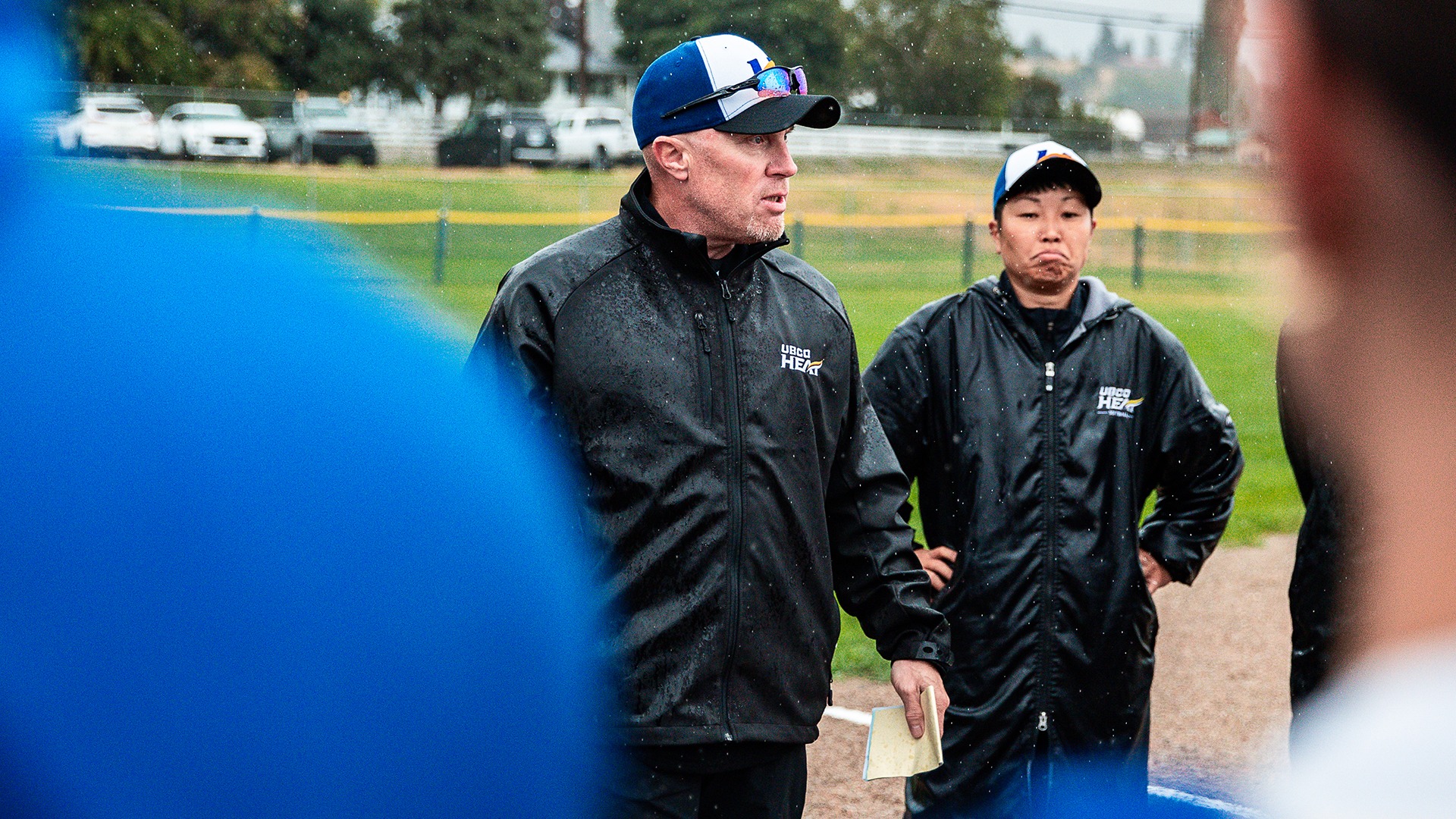 UBCO Heat softball head coach Doug Allin speaks to his team prior to a game at High Noon Park against the Lethbridge Pronghorns.