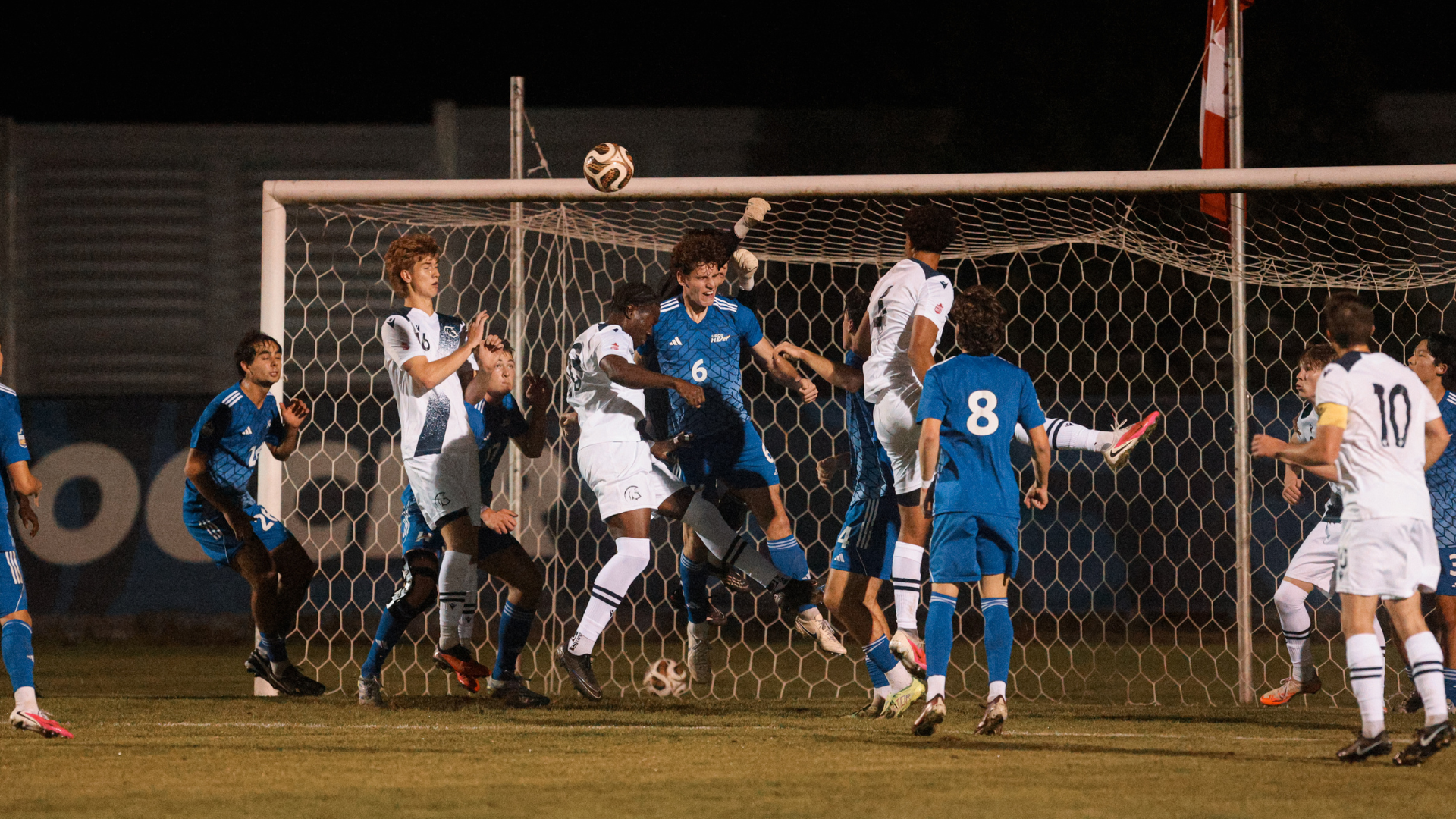 Mens Socccer vs TWU - Heading the ball from a corner kick