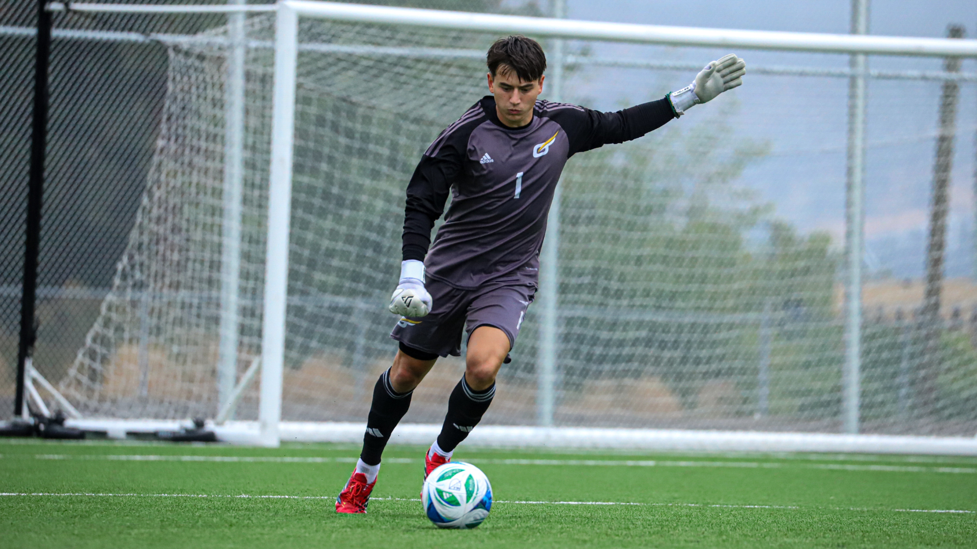 Ronan Woodroffe of the UBCO heat mens soccer team lines up to kick the ball vs Victoria Vikes