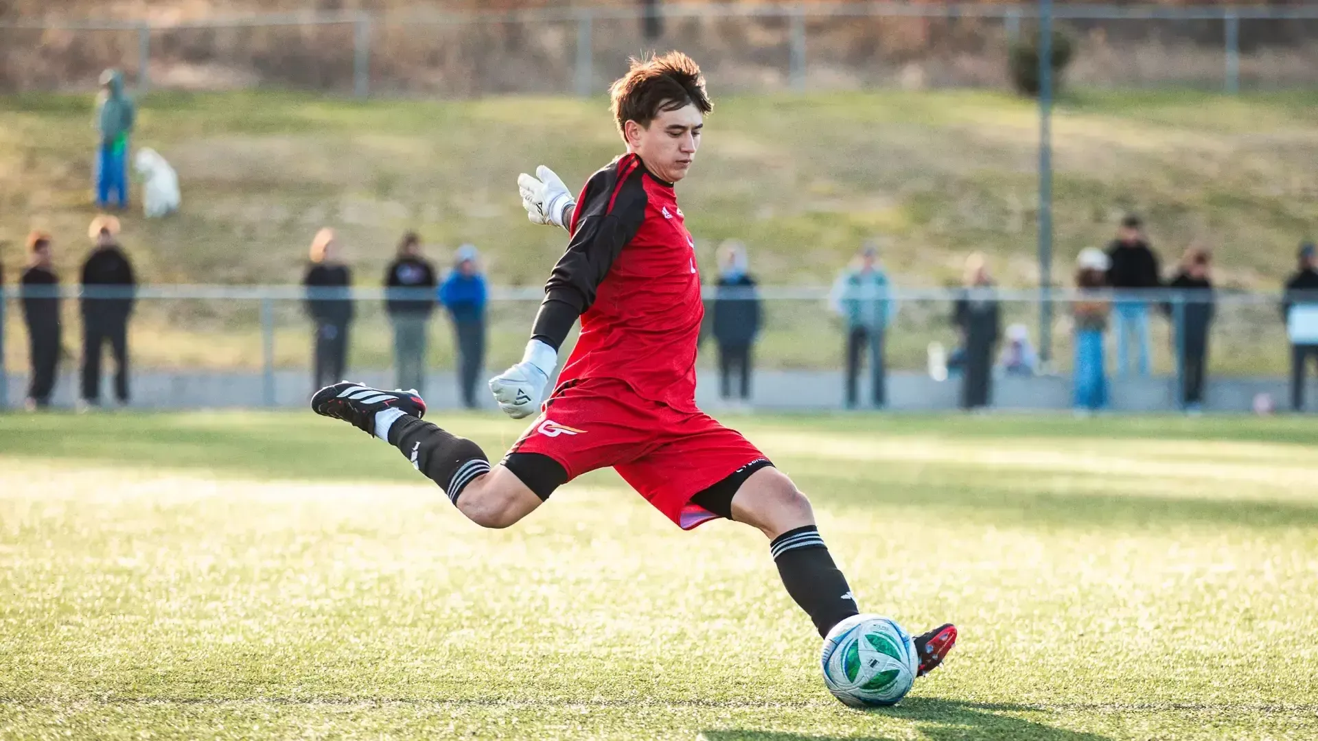 Ronan Woodroffe of the UBCO Heat Mens Soccer team kicks the ball vs UFV