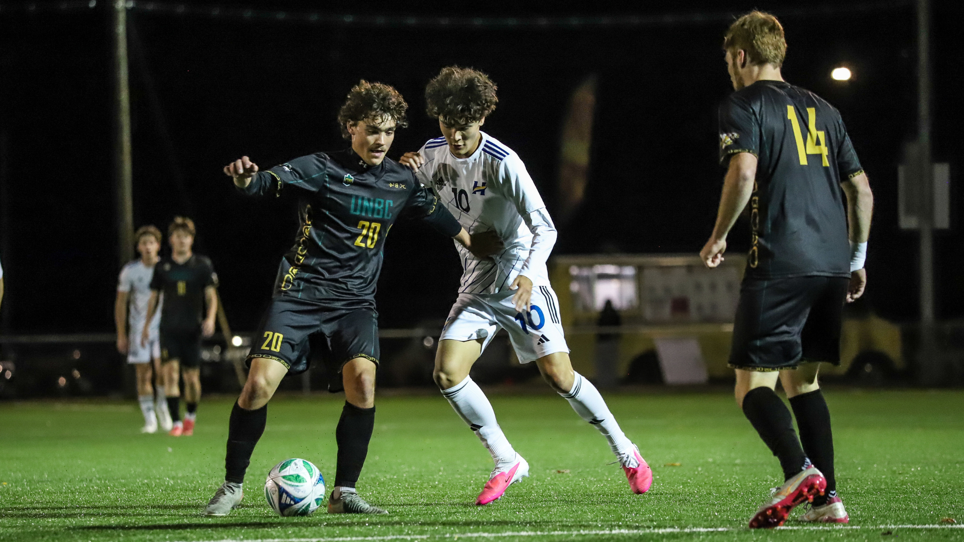 Will Armitage of the UBCO Heat Mens soccer team challenges the ballvs UNBC Timberwolves