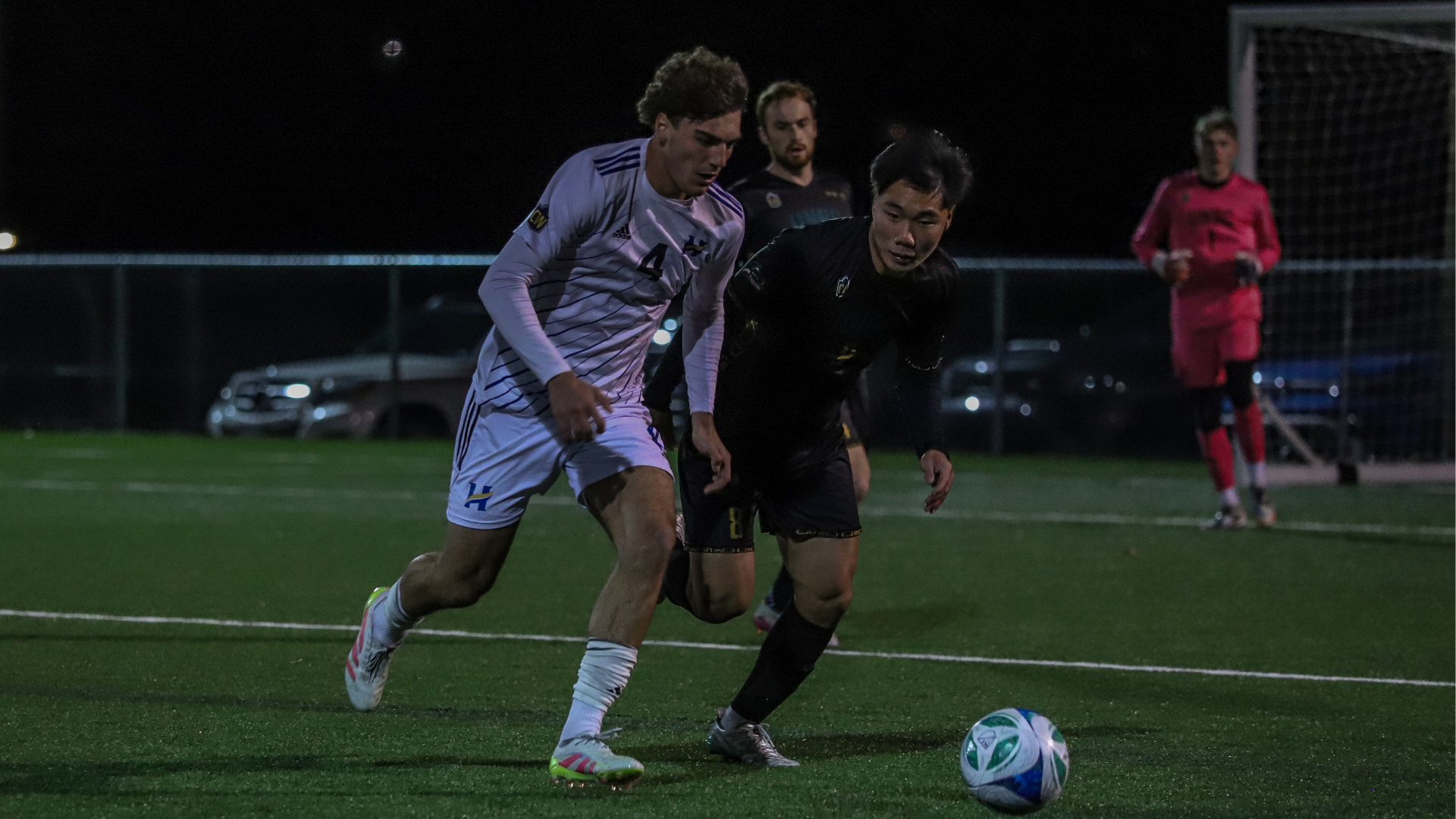 Carter Brown battling for the ball with UNBC Timberwolves