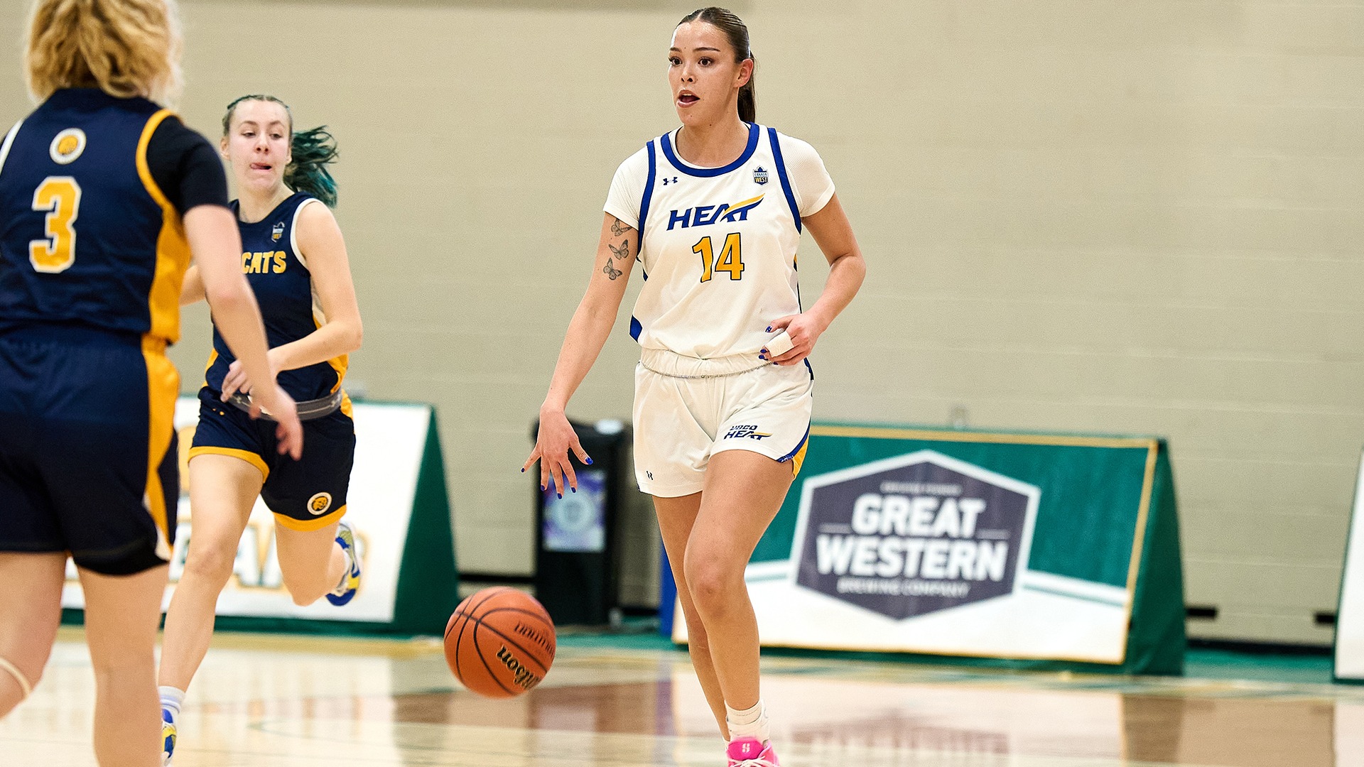 UBCO guard Kanani Coon brings the ball up the floor during action against the Brandon Bobcats in the Canada West Play-In Round in Regina.