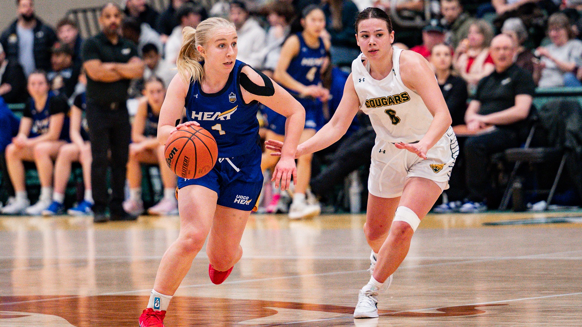 UBCO guard Kiana Kaczur drives past her defender during action against the Regina Cougars in the Canada West Quarter-finals in Regina.