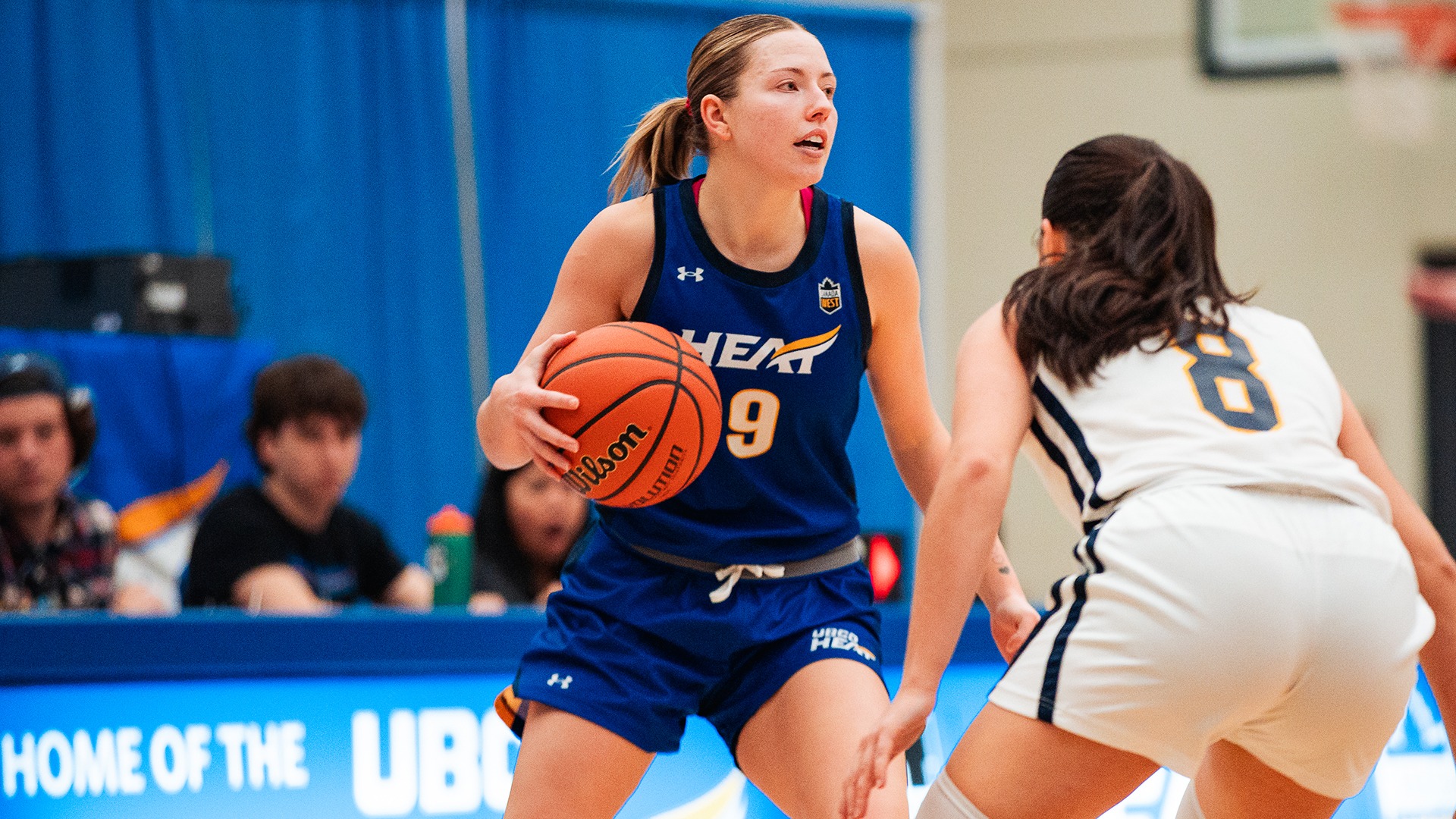 UBCO guard Lily Pink surveys her options against the UBC Thunderbirds at the UBCO Gymnasium.