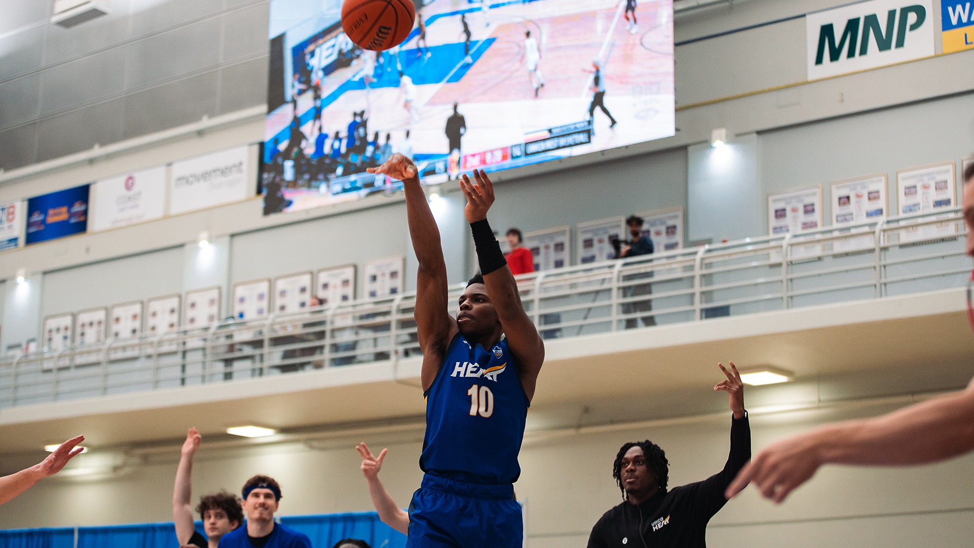 UBCO guard Jalen Shirley launches a three-pointer en route to setting the UBCO Heat all-time scoring record against the UFV Cascades at the UBCO Gymnasium.