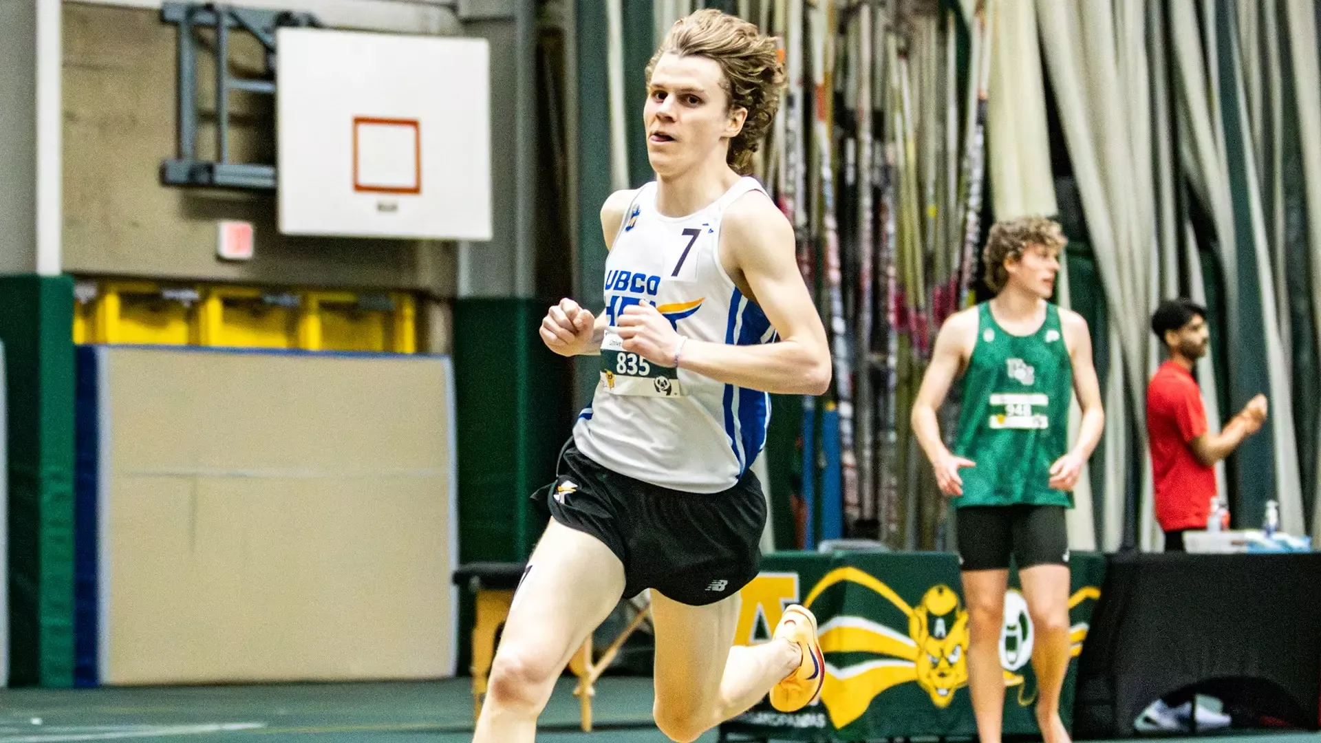 UBCO middle distance runner Kyle Porter rounds a bend during the 3000m race at the 2026 Pandas Open in Edmonton.