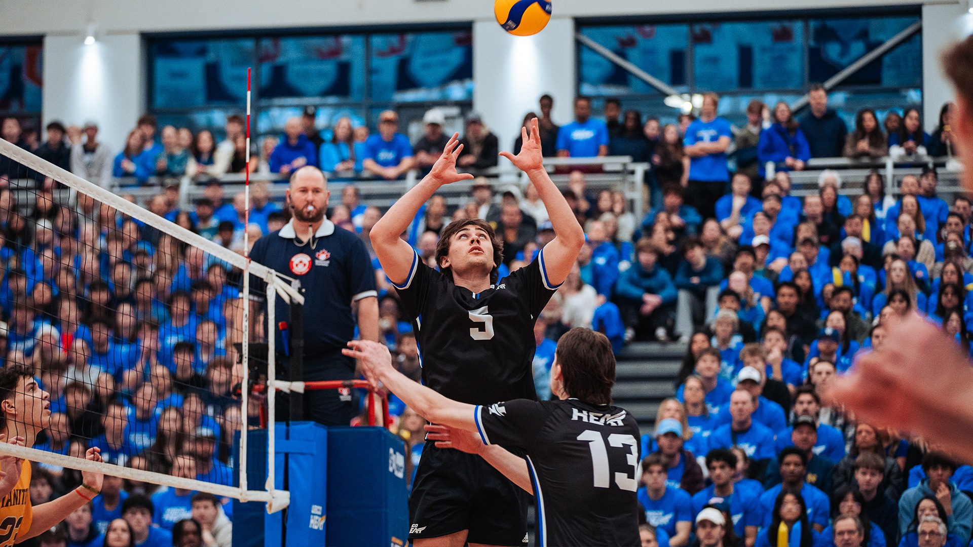 UBCO setter Zach van Geel prepares to set a ball during action against the Manitoba Bisons in Game 3 of their Canada West Quarter-final series at the UBCO Gymnasium.