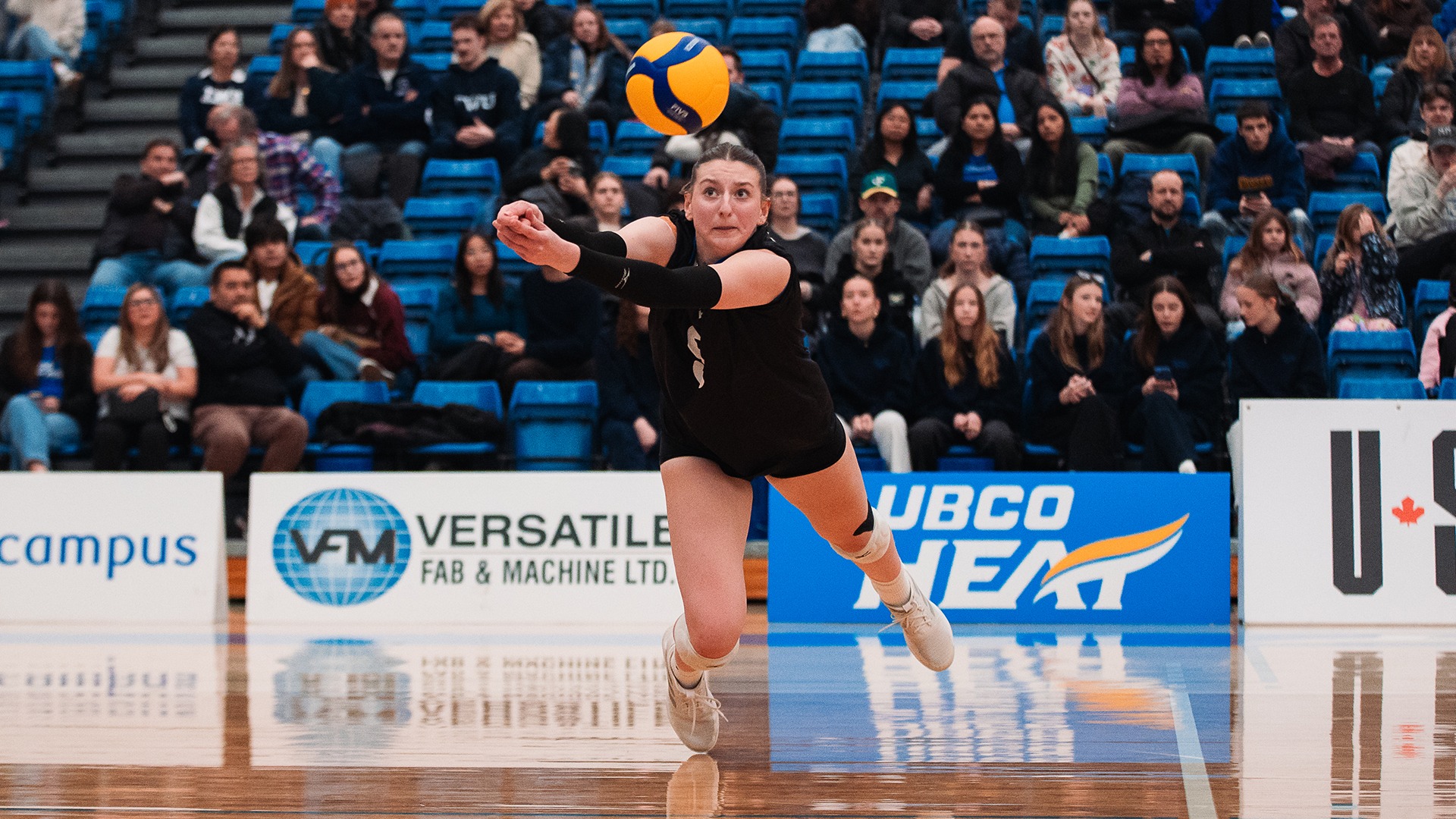 UBCO middle Ali Rathlef digs a ball during action against the Trinity Western Spartans at the UBCO Gymnasium.