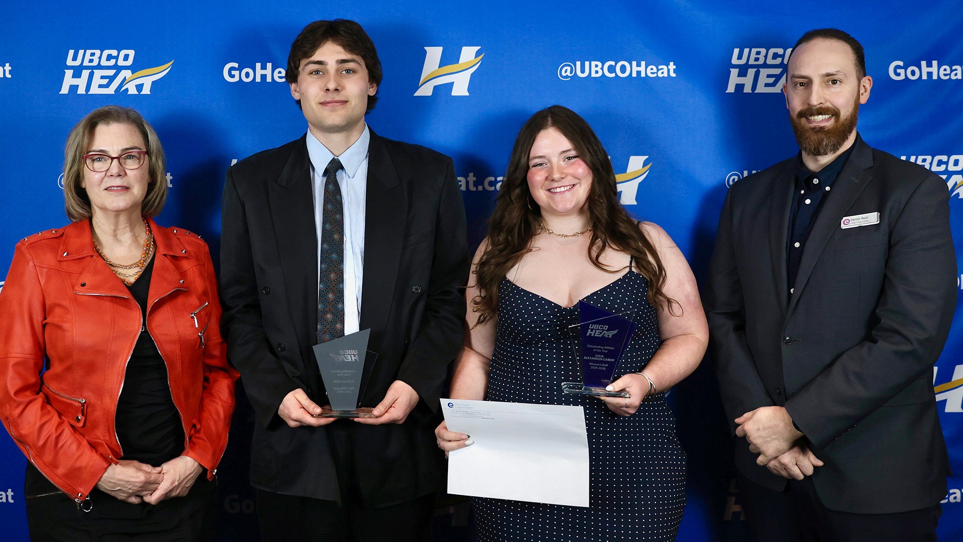 UBCO Heat Outstanding Athletes of the Year Zach van Geel and Julia Alexander-Carew (middle) are flanked by UBCO Principal and Deputy Vice-Chancellor Dr. Lesley Cormack (left) and Coast Capri Hotel representative Daniel Ruel (right)