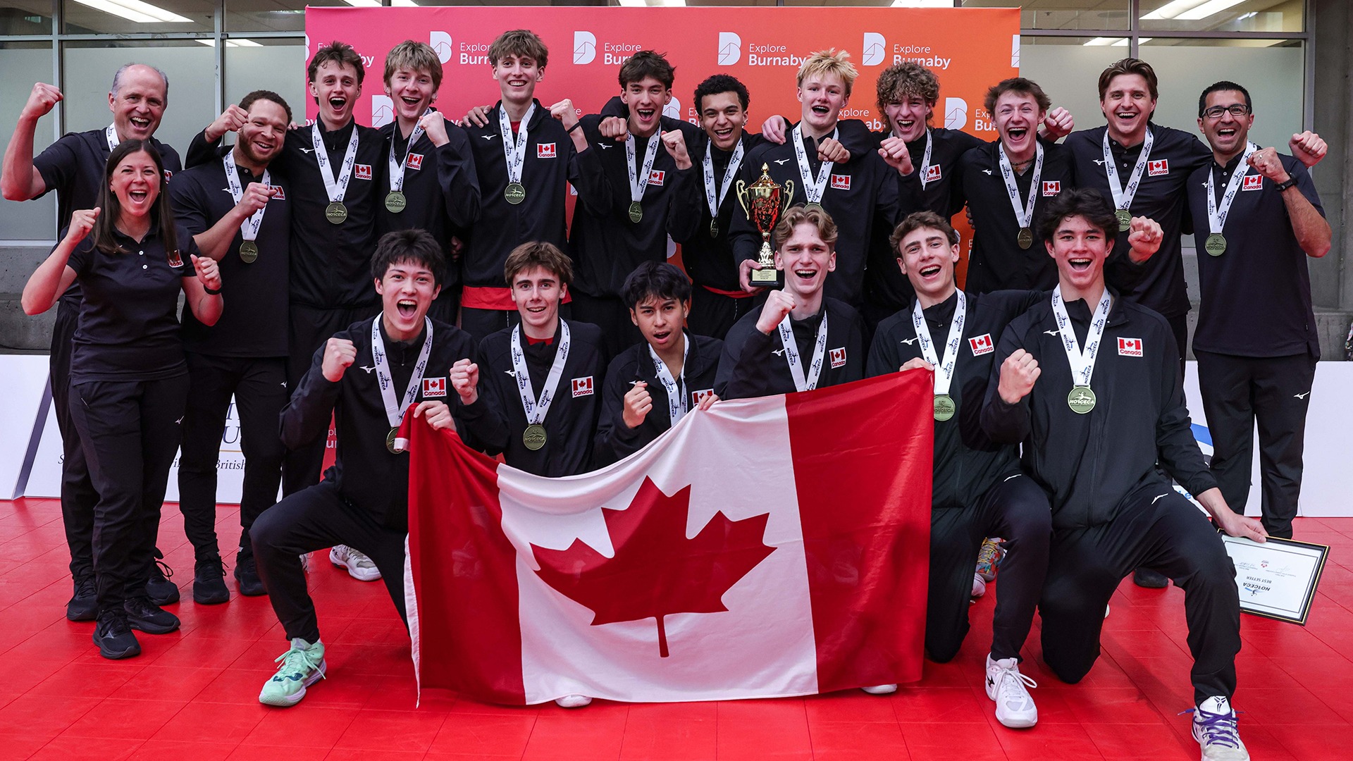 UBCO Heat men's volleyball head coach Scott Koskie (back row, first on the left) celebrates with Team Canada after winning the gold medal at the NORCECA Men's U19 Continental Championship