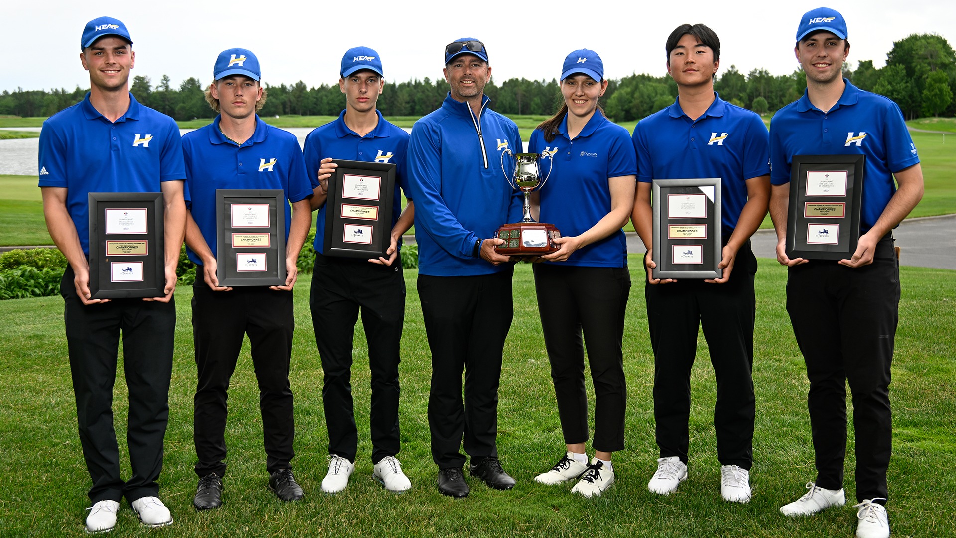 From left to right, Ryan Gillis, Ryan Vest, Oakley Mayner, head coach Clay Stothers, assistant coach Mackenzie Barrie, Chris Jo and Andrew Rouble pose with the 2026 Golf Canada Canadian University/College Championship plaques and trophy at Golf La Tempête in Lévis, Quebec.