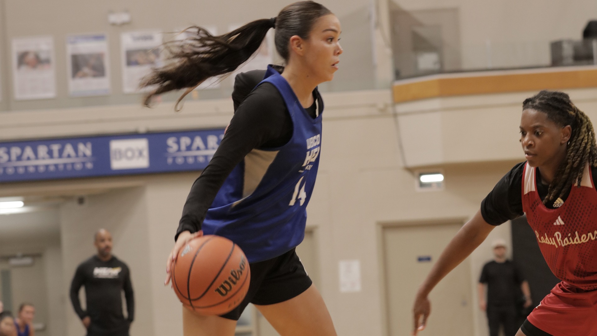 UBCO guard Kanani Coon sizes up a Texas Tech guard as she drives to the basket during preseason action against the Lady Raiders in Langley.