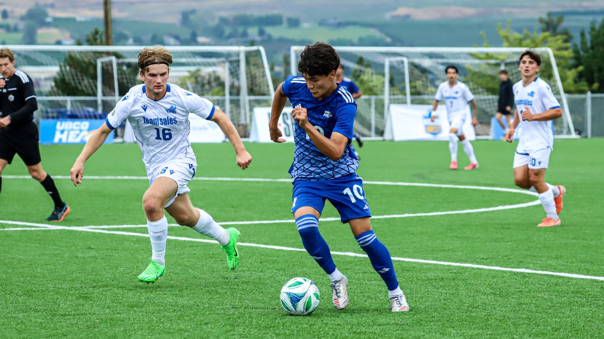 UBCO midfielder Will Armitage dribbles the ball against the Victoria Vikes at Nonis Sports Field. 