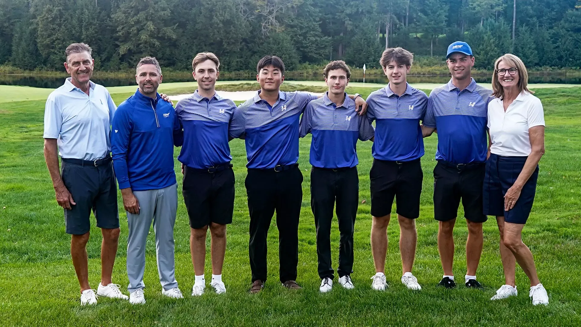 The men's golf team along with head coach Clay Stothers poses for a team photo at Canadian Collegiate Invitational