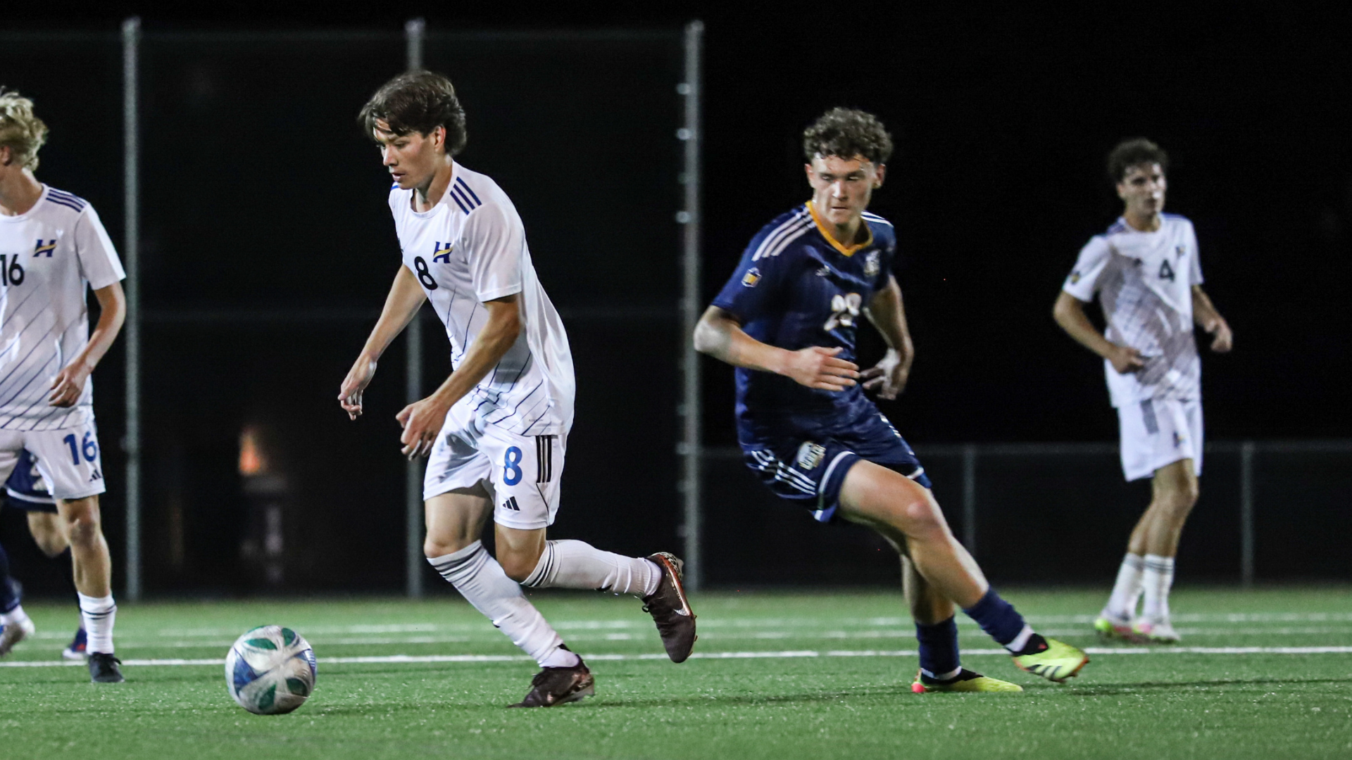 UBCO #8 Ian Ballantyne carries the ball against UBC on Nonis Sports Field