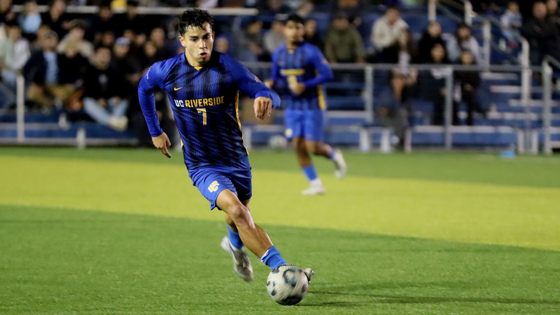 Edward Castro dribbles against CSUB