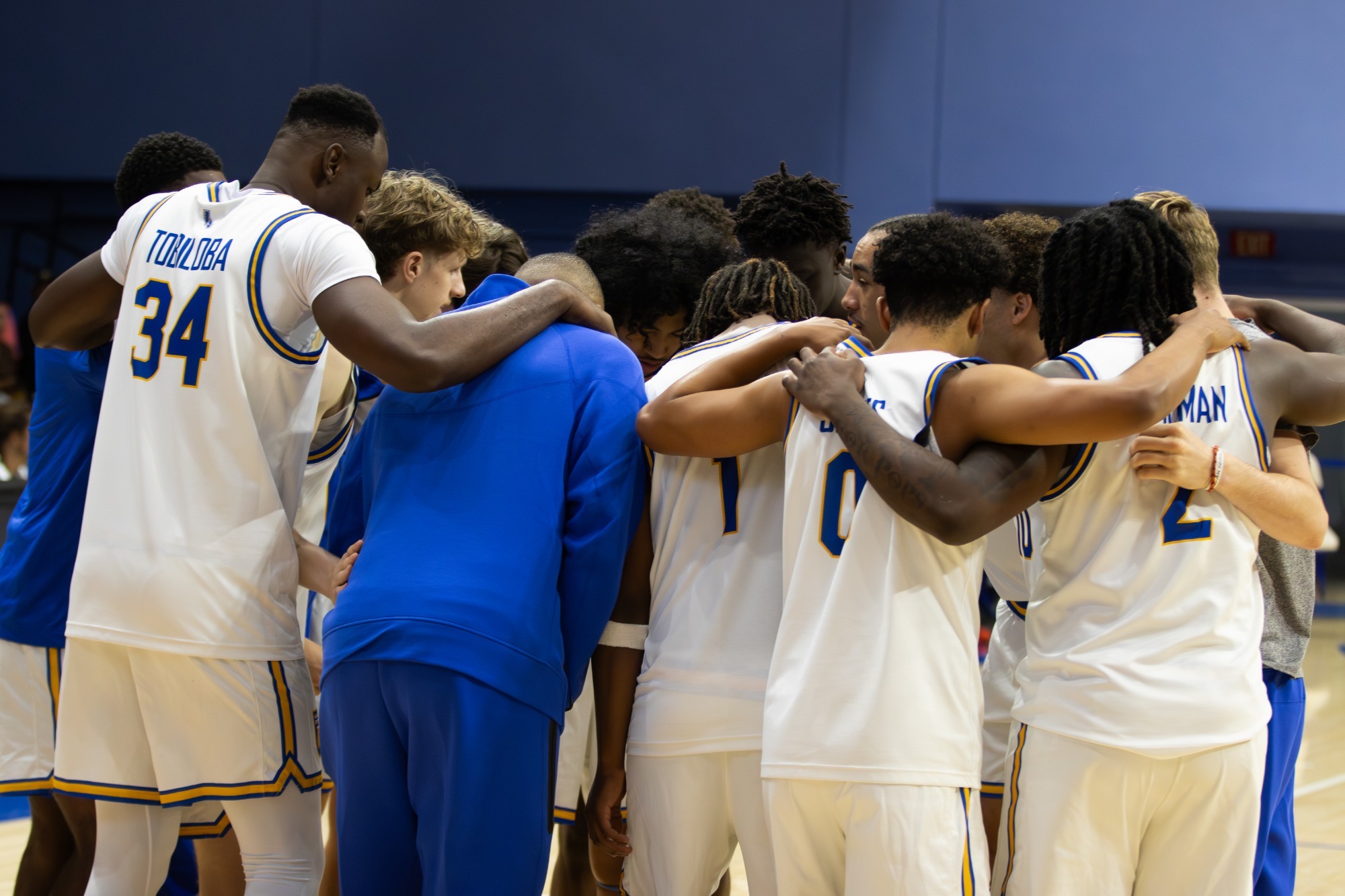 Men's Basketball Team Huddle