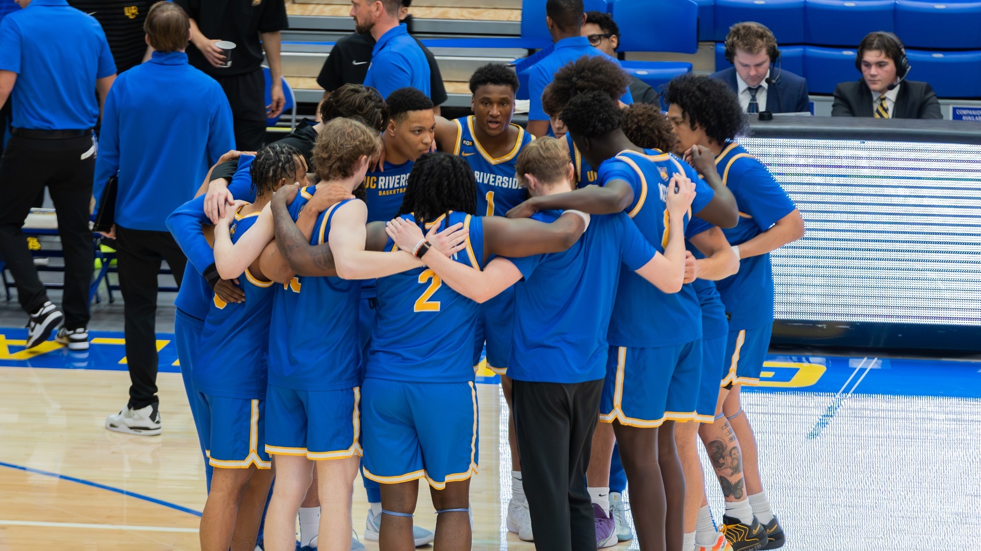 Men's Basketball Team Huddle