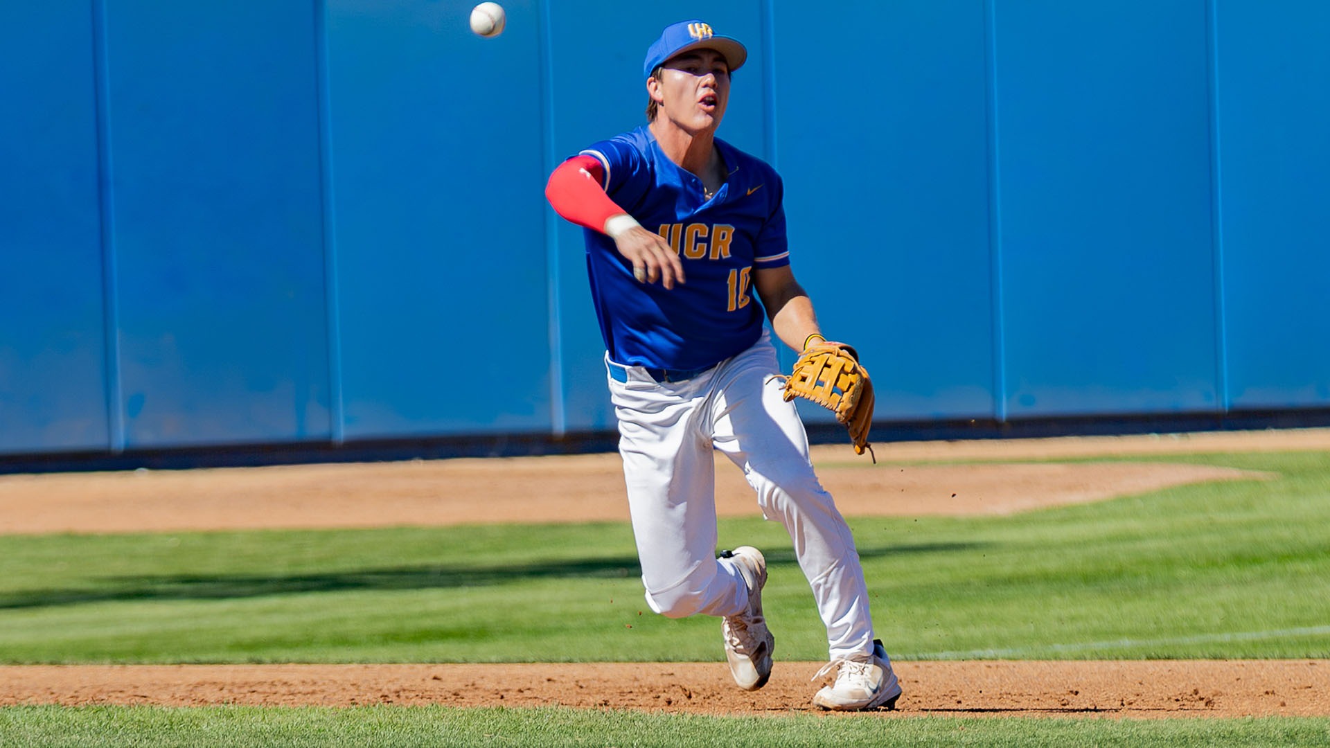 Lucas Bonham at third base throws the ball