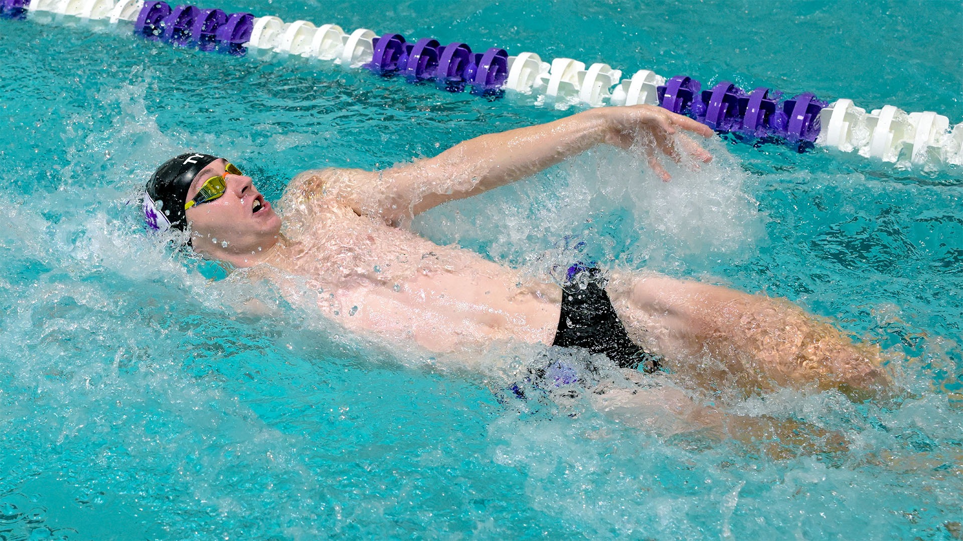 Will Clark swimming the backstroke against Boston University.