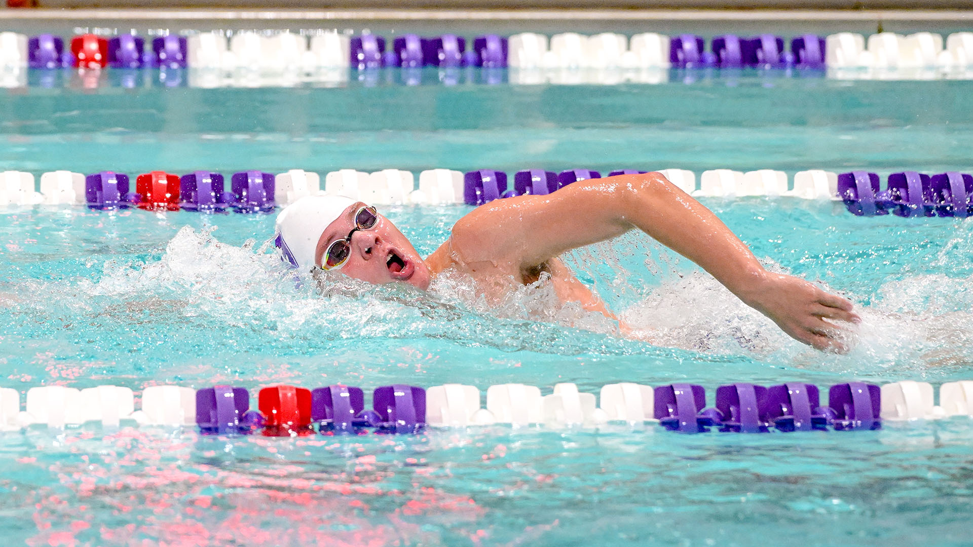 Anderson Bishop swimming against Boston University.