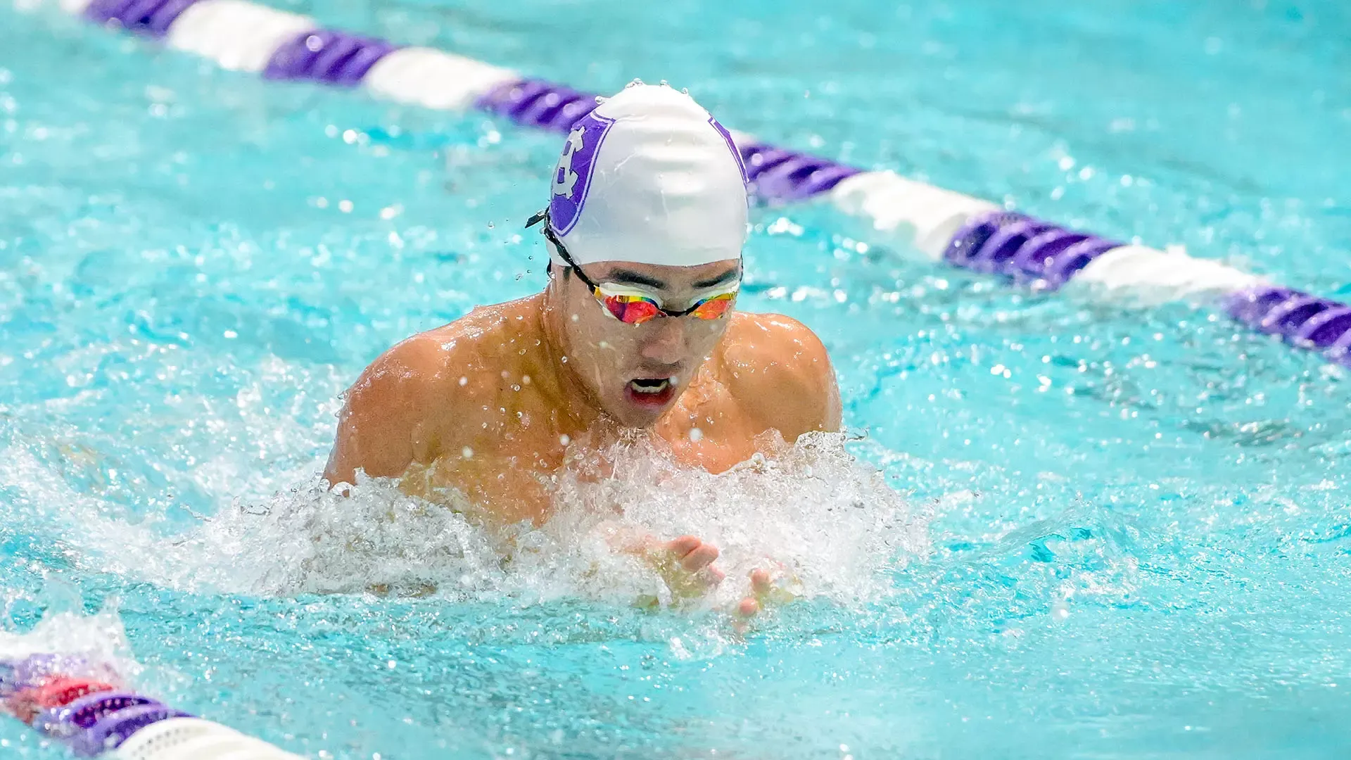 Samuel Lee swimming against Boston University.
