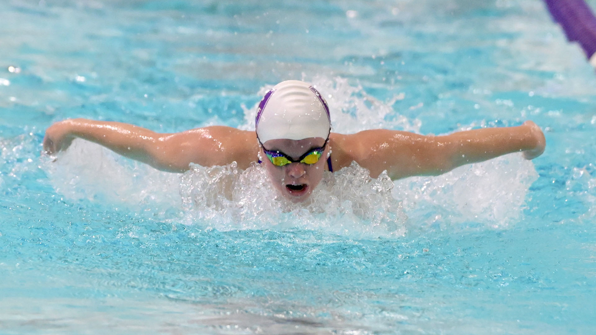 Megan Nelson swimming against Boston University.