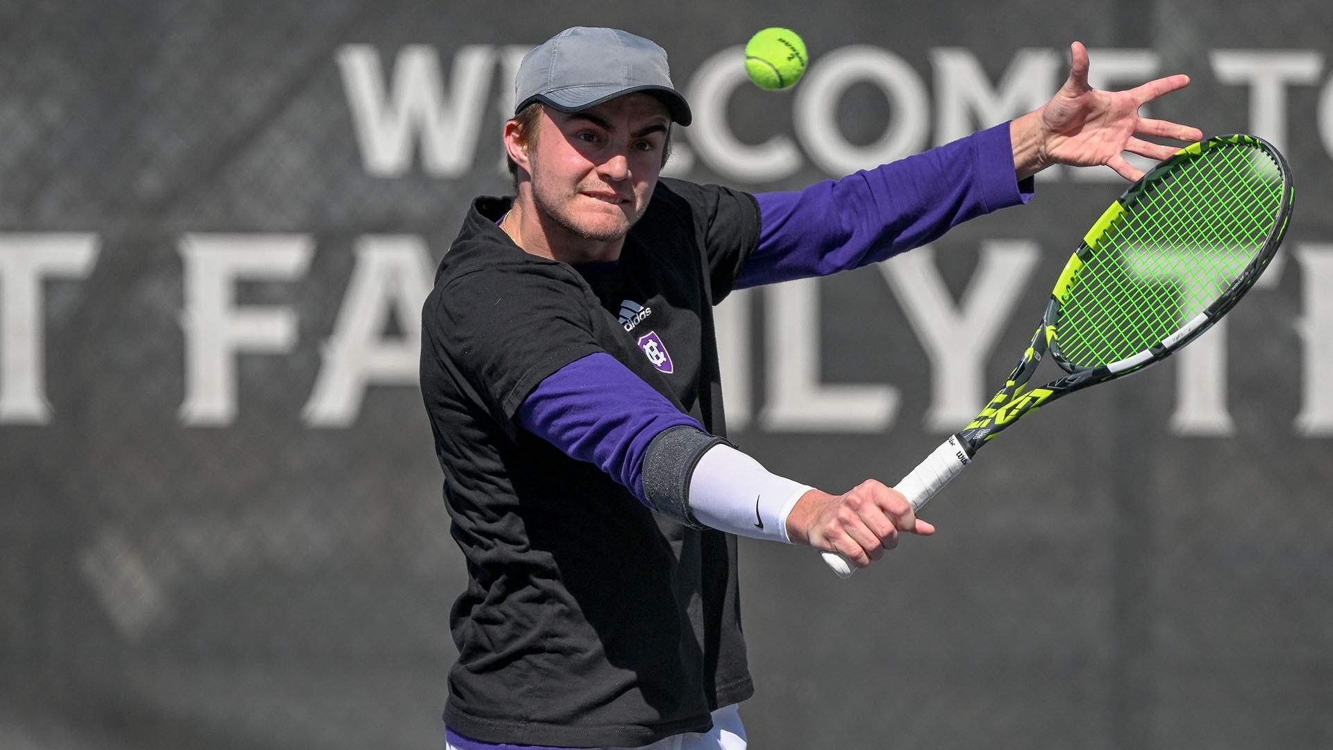Matt Carlson hitting a backhand against Colgate.