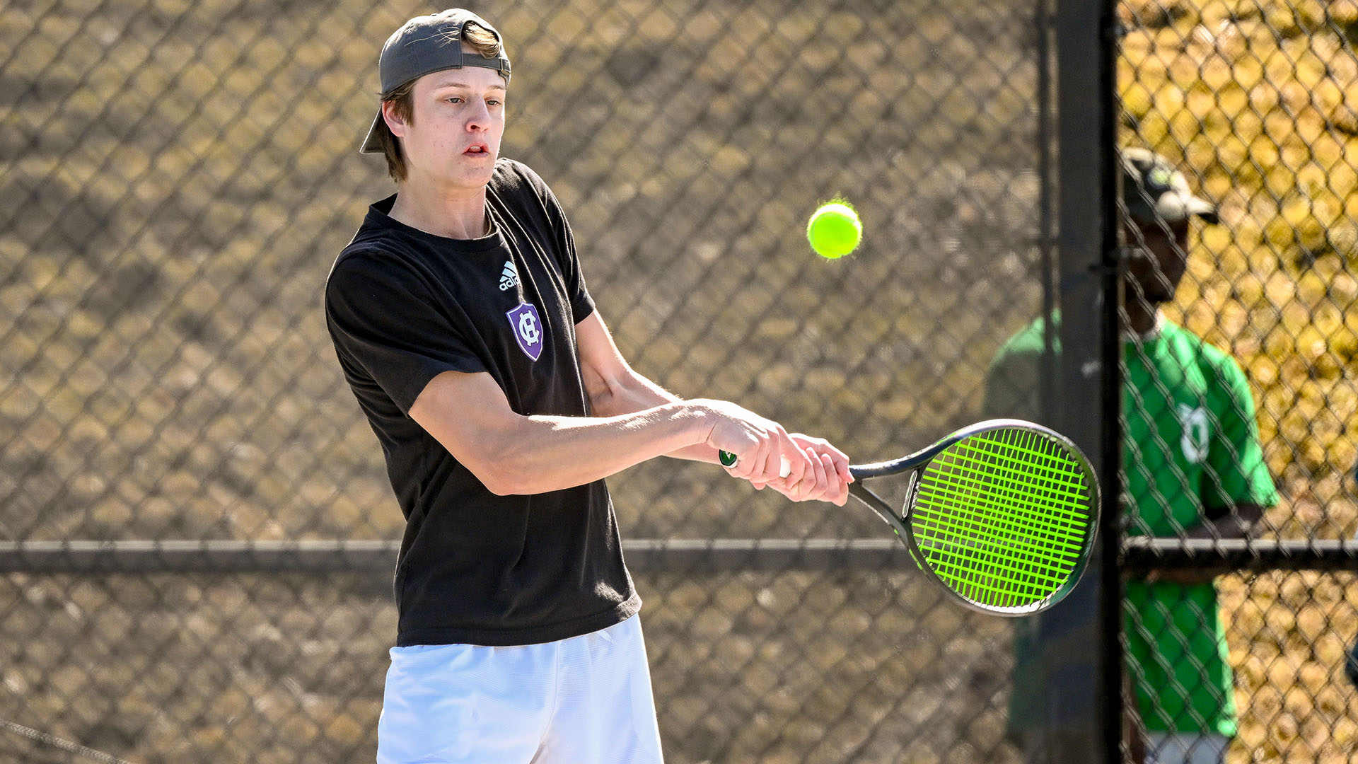 Teddy Callery hitting a backhand against Colgate.