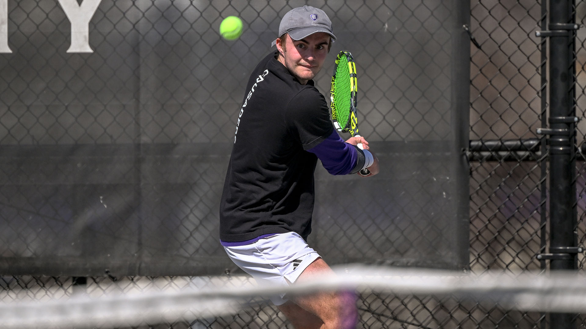 Matt Carlson hitting a backhand against Colgate.