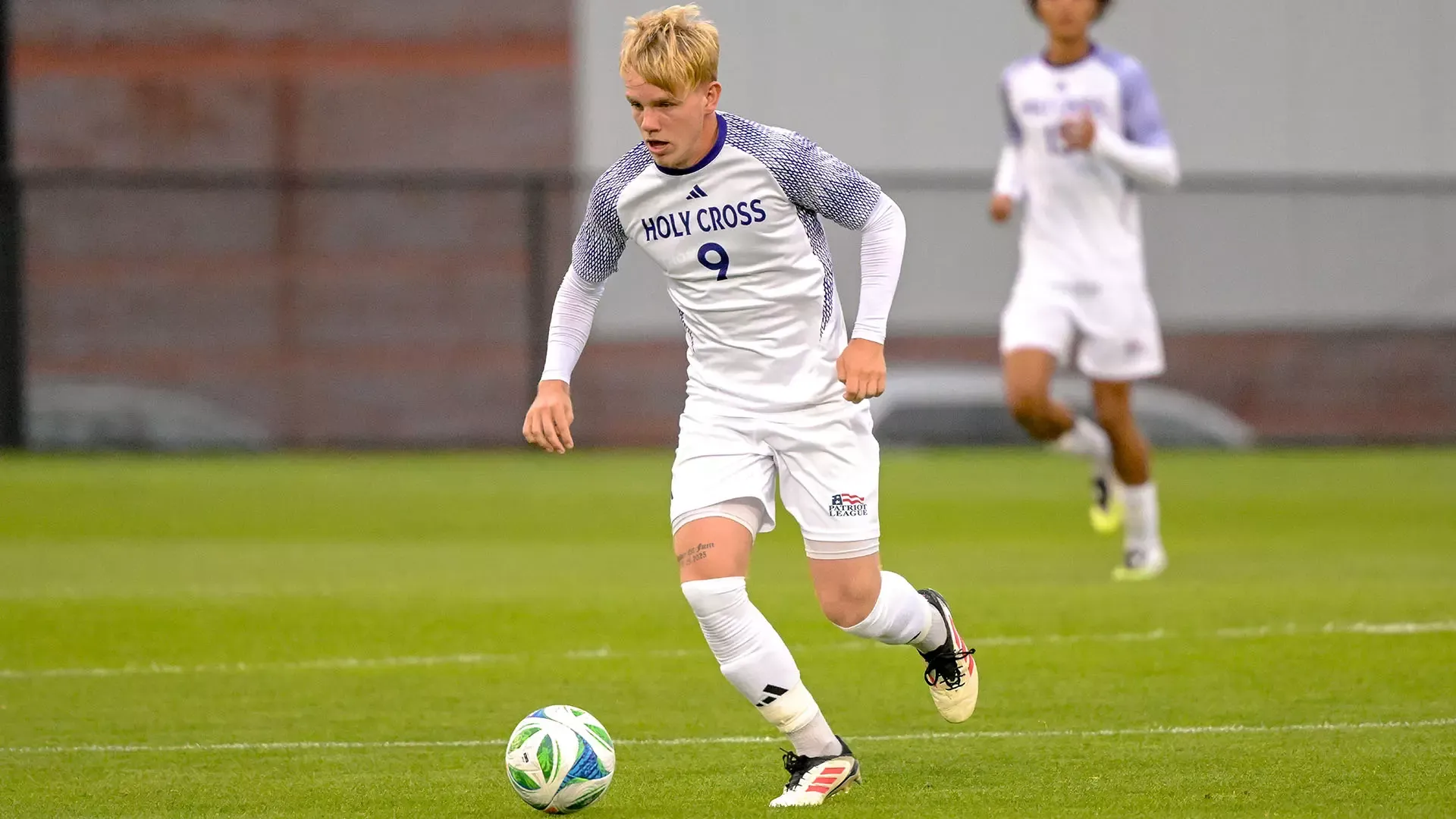 Archie Hatcher with the ball during the victory over Rhode Island.