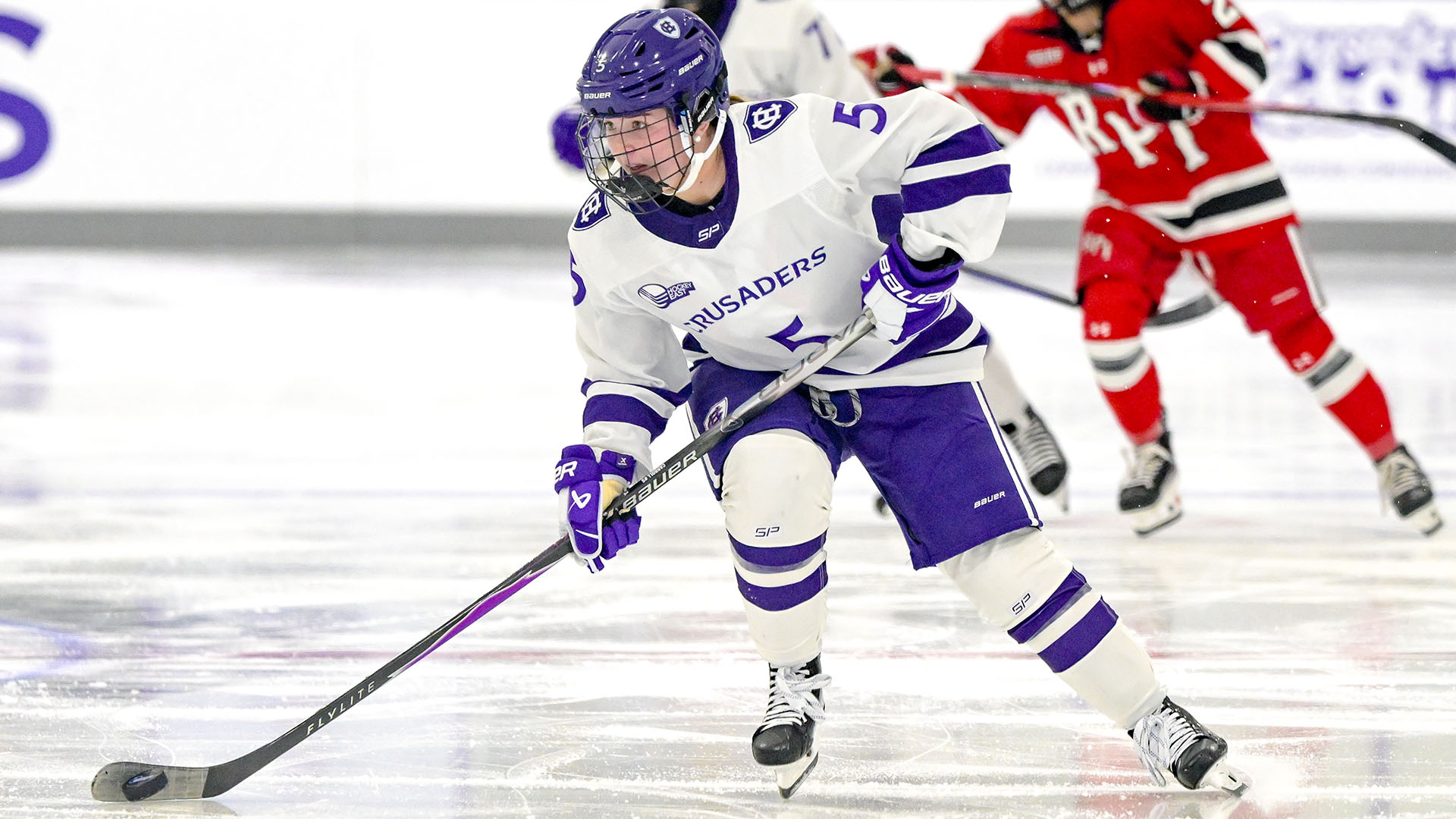 Violet Carroll with the puck against RPI.