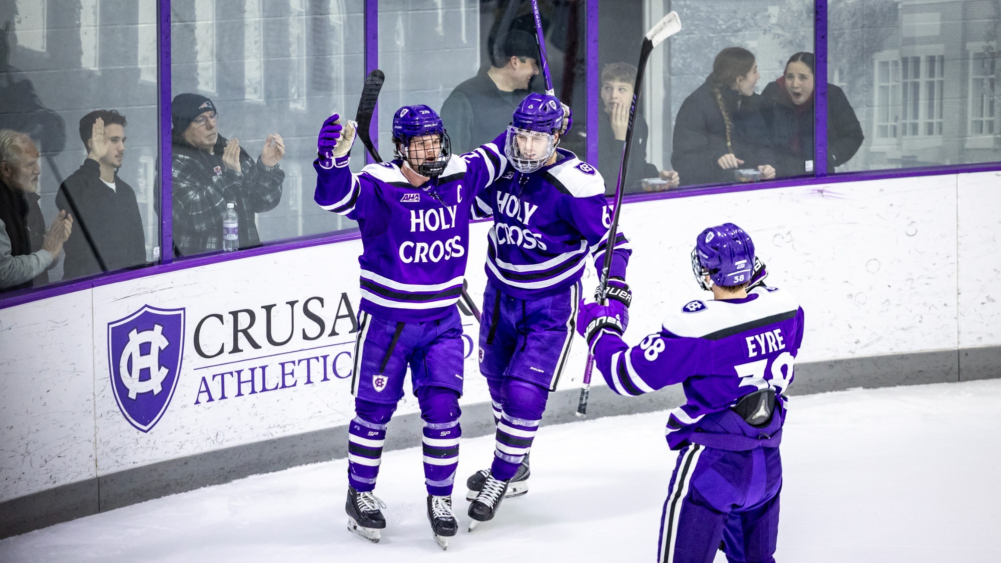 Jack Seymour, Timothy Heinke, and Noah Eyre celebrate a goal against Merrimack