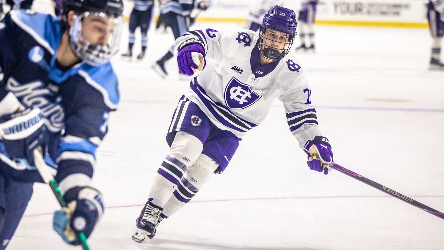 Owen Kim defends against Maine