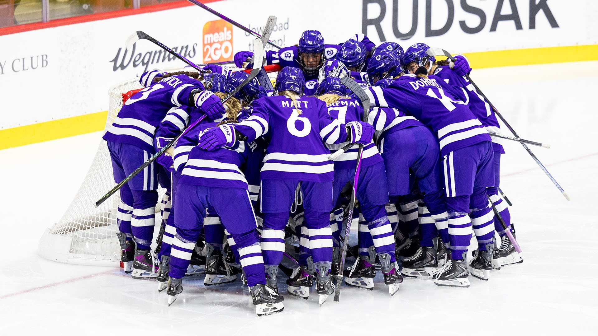The Crusaders huddle during their game at Harvard