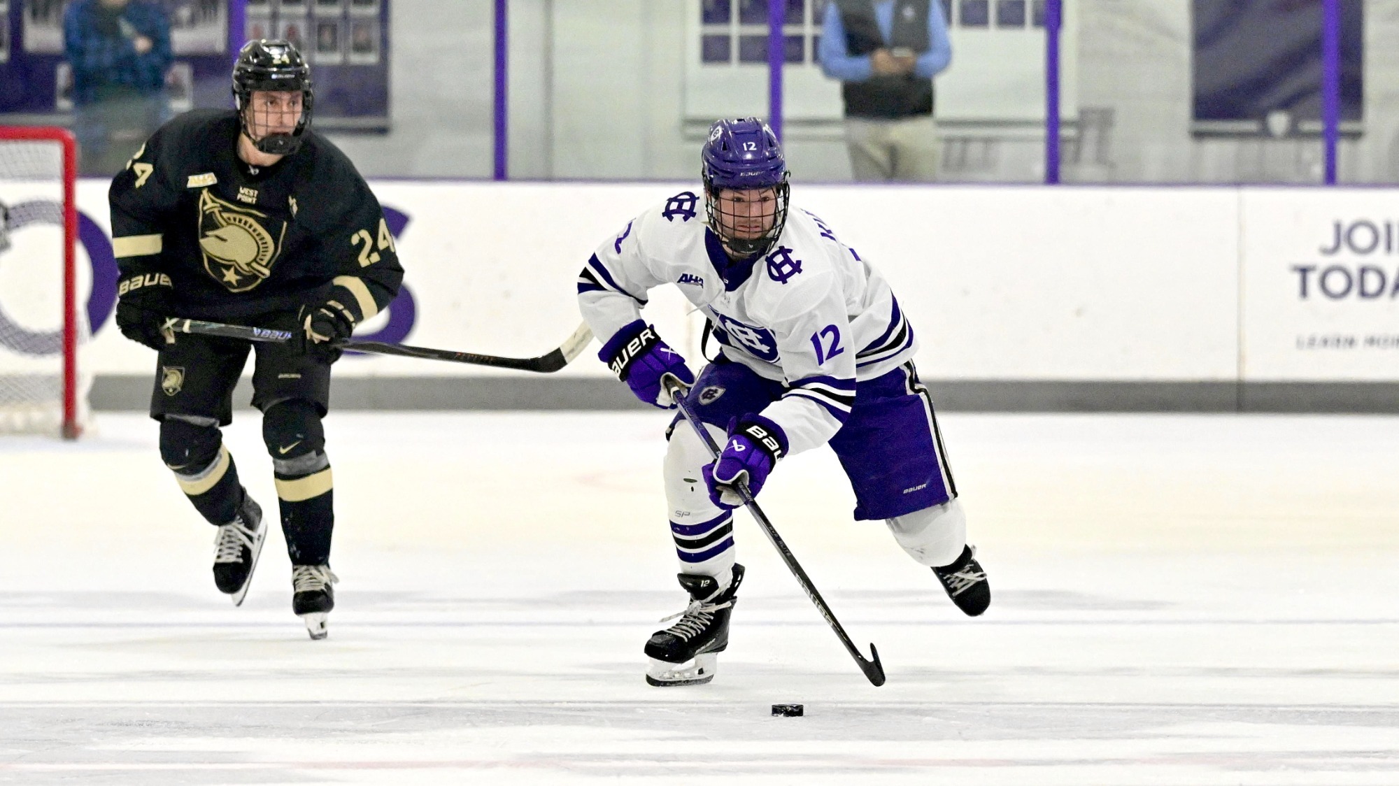 Matt Kursonis skates with the puck against Army
