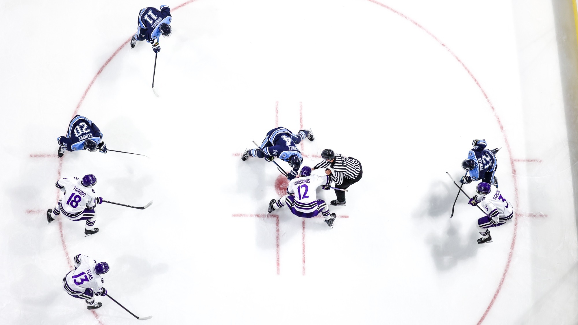 Men's ice hockey lines up for a faceoff against Maine
